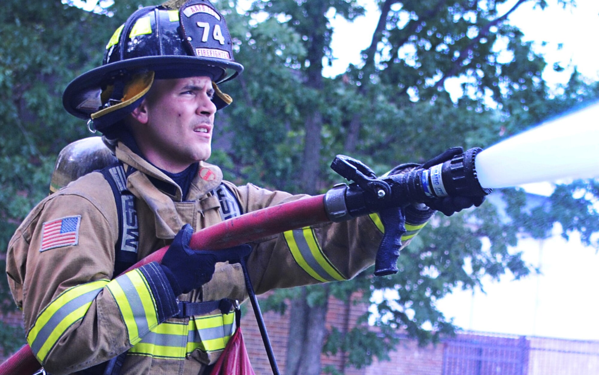 Airman 1st Class Jim Chavez, 11th Civil Engineer Squadron firefighter, practices operating the water hose as part of his training here at Joint Base Andrews, Md., July 24, 2013. Firemen train to be experts in each aspect of their job. (U.S. Air Force photo/Airman 1st Class Joshua R. M. Dewberry)