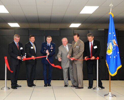 Maj. Gen. William McCasland (center), Air Force Research Laboratory (AFRL) commander, hosts a ribbon-cutting for the “Spirit supercomputer.  Joining the general are (from left) Bobby Hunter, Department of Defense High Performance Computing Modernization Program associate director; Jim Brickner, president of SGI Federal; former Congressman Dave Hobson, U.S. Rep. Mike Turner; and Jeff Graham, director of AFRL’s DoD Supercomputer Resource Center. (U.S. Air Force photo by Niki Jahns)