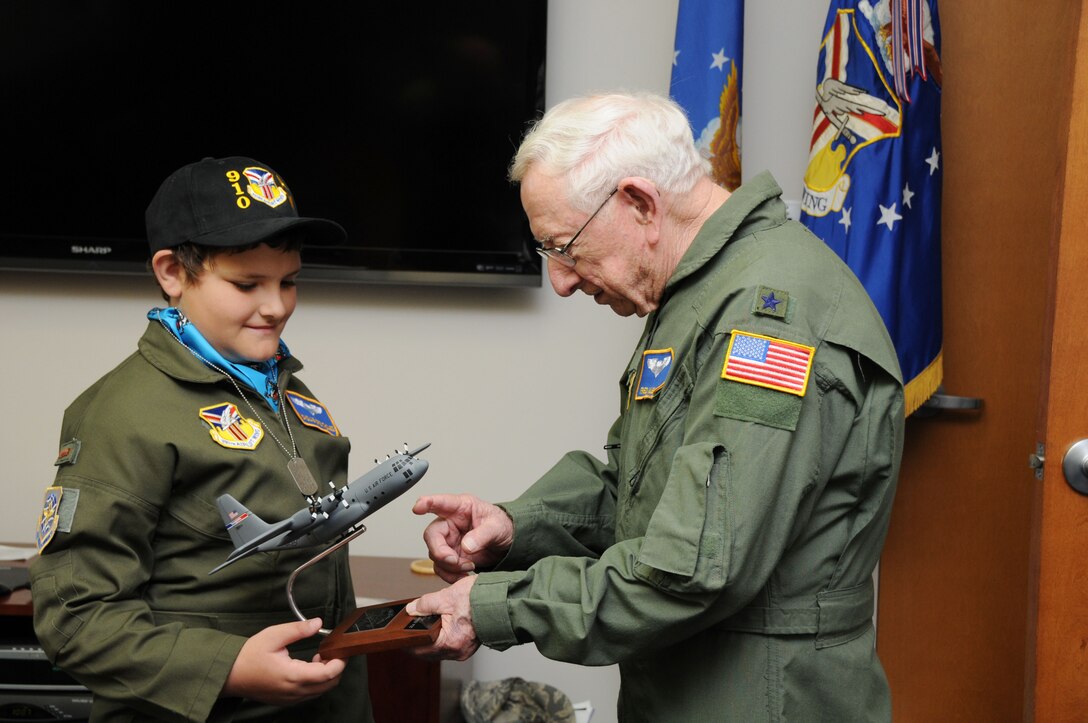 YOUNGSTOWN AIR RESERVE STATION, Ohio -- The 910th Airlift Wing's 54th Pilot for a Day, honorary 2nd Lieutenant Nicholas Greathouse, receives a model C-130H Hercules aircraft from honorary Brigadier General and honorary base commander Fred Kubli. Jr., here, July 24. Kubli presented the model on behalf the Youngstown Air Reserve Base Community Council, for which he is treasurer. Pilot for a Day is a community outreach program that works through Akron Children's Hospital Boardman to welcome children with chronic or life-threatening illnesses to the station for a day of military experiences. U.S. Air Force photo by SrA Rachel Kocin.