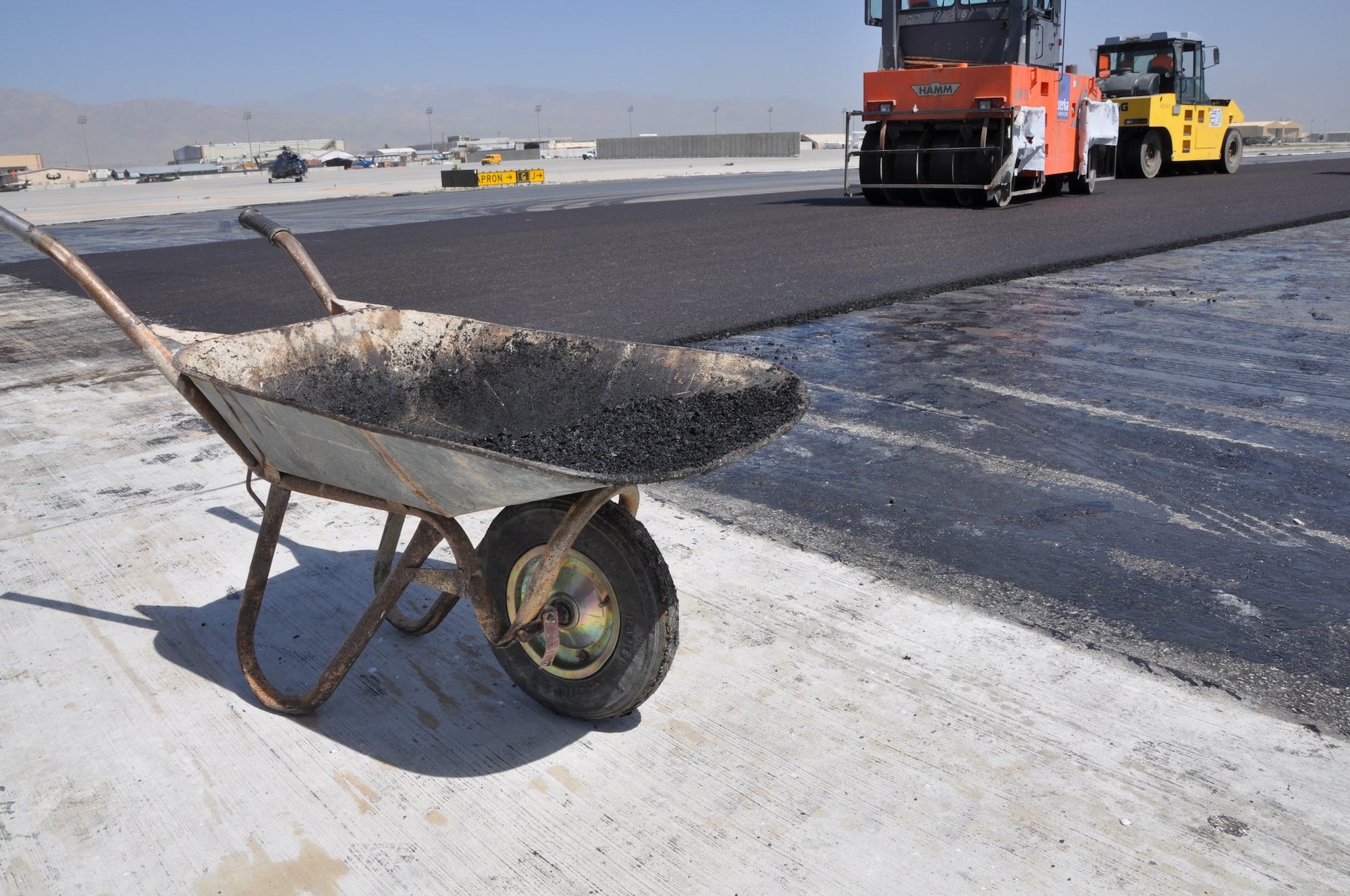Ongoing runway repairs take place at Bagram Airfield, Afghanistan, July 26, 2013. The first phase of a major runway project on the Department of Defense’s busiest runway is scheduled to be completed here Aug. 10. Phase I included the repair and resurfacing of the Russian runway, built in 1959, to allow it to become a temporary runway while the primary runway is repaired. Soon after, the contractor will start Phase II work on the primary runway, which will last four months.