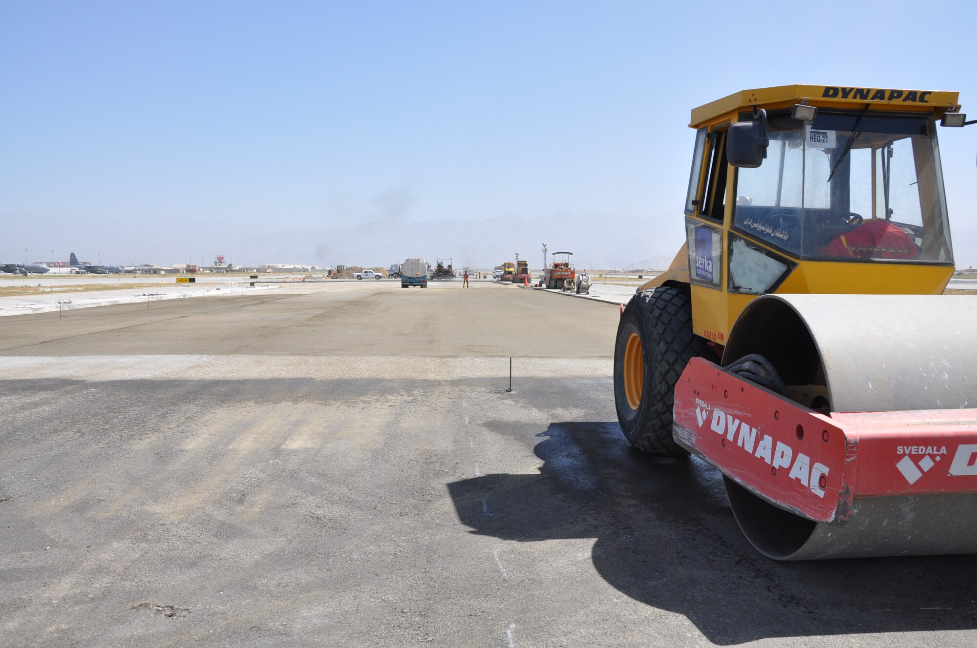 Ongoing runway repairs take place at Bagram Airfield, Afghanistan, July 26, 2013. The first phase of a major runway project on the Department of Defense’s busiest runway is scheduled to be completed here Aug. 10. Phase I included the repair and resurfacing of the Russian runway, built in 1959, to allow it to become a temporary runway while the primary runway is repaired. Soon after, the contractor will start Phase II work on the primary runway, which will last four months.