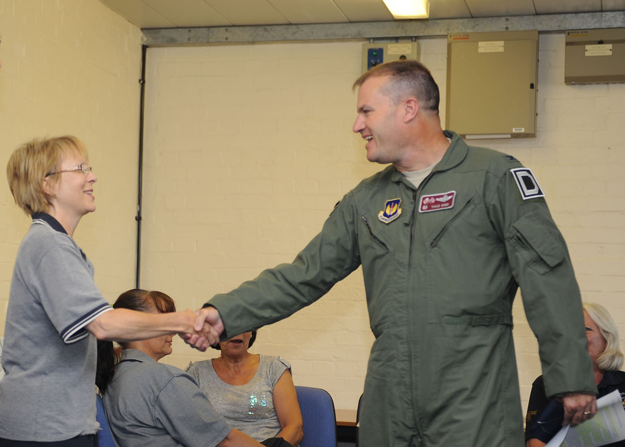 From right, Col.  Kenneth Bibb Jr., 100th Air Refueling Wing commander, meets with civilian members of Team Mildenhall during a Sexual Assault Prevention and Response briefing July 26, 2013, on RAF Mildenhall, England. The discussion, with civilian members of the 100th Force Support Squadron billeting team, was part RAF Mildenhall’s annual SAPR training. Another benefit of the briefing was to let civilian members know they were not forgotten and part of Team Mildenhall. (U.S. Air Force photo by Airman 1st Class Preston Webb/Released)