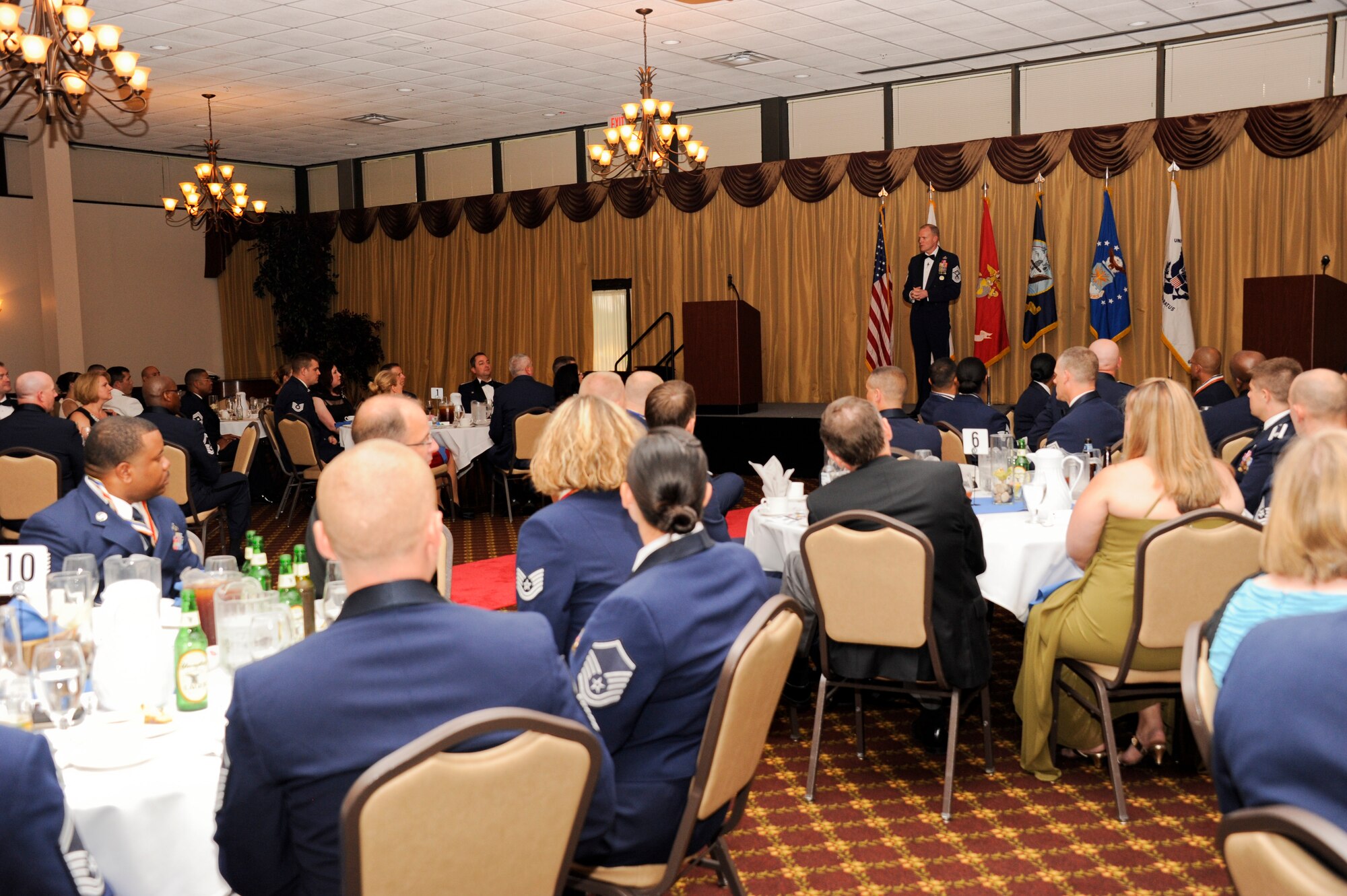 Seventy-five master sergeant selects, along with their friends and family members, listen to Chief Master Sgt. of the Air Force James Cody address the future leaders at the annual Senior Noncommissioned Officer Induction Ceremony July 19, 2013, at the Tommy B. McGuire Community Center on Joint Base McGuire-Dix-Lakehurst, N.J. Before the induction, the chief spent the day with Airmen across the base, sharing his knowledge with the First-Term Airman Center and also giving advice to the master sergeant selects. (U.S. Air Force photo by Airman Tara A. Williamson/Released)