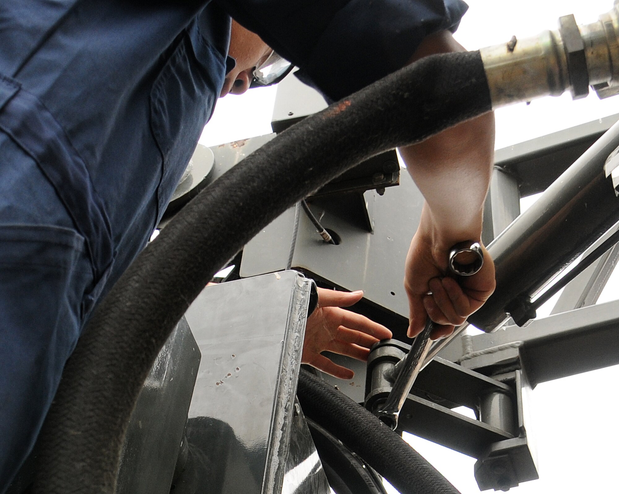 Airman 1st Class Andrew Ka, 100th Logistics Readiness Squadron vehicle maintainer from Los Angeles, Calif., inspects the hydraulic cylinder mounts on a condor aircraft de-icer July 10, 2013, on RAF Mildenhall, England. This vehicle is used to clear the ice from C-5s and other large aircraft. These types of inspections are completed on all vehicles when the shop receives, ships or deploys them. (U.S. Air Force photo by Gina Randall/Released)
