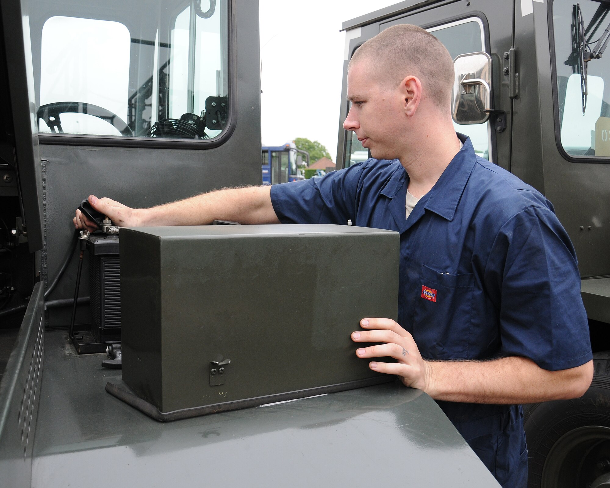 Senior Airman Joey Hines, 100th Logistics Readiness Squadron vehicle maintainer from Tampa, Fla., changes the battery on an MB-4 Aircraft Tow Vehicle July 10, 2013, on RAF Mildenhall, England. RAF Mildenhall currently has 565 assigned vehicles, 181 of which are considered priority one and priority two assets. Priority one and two vehicles directly support flying operations. (U.S. Air Force photo by Gina Randall/Released)