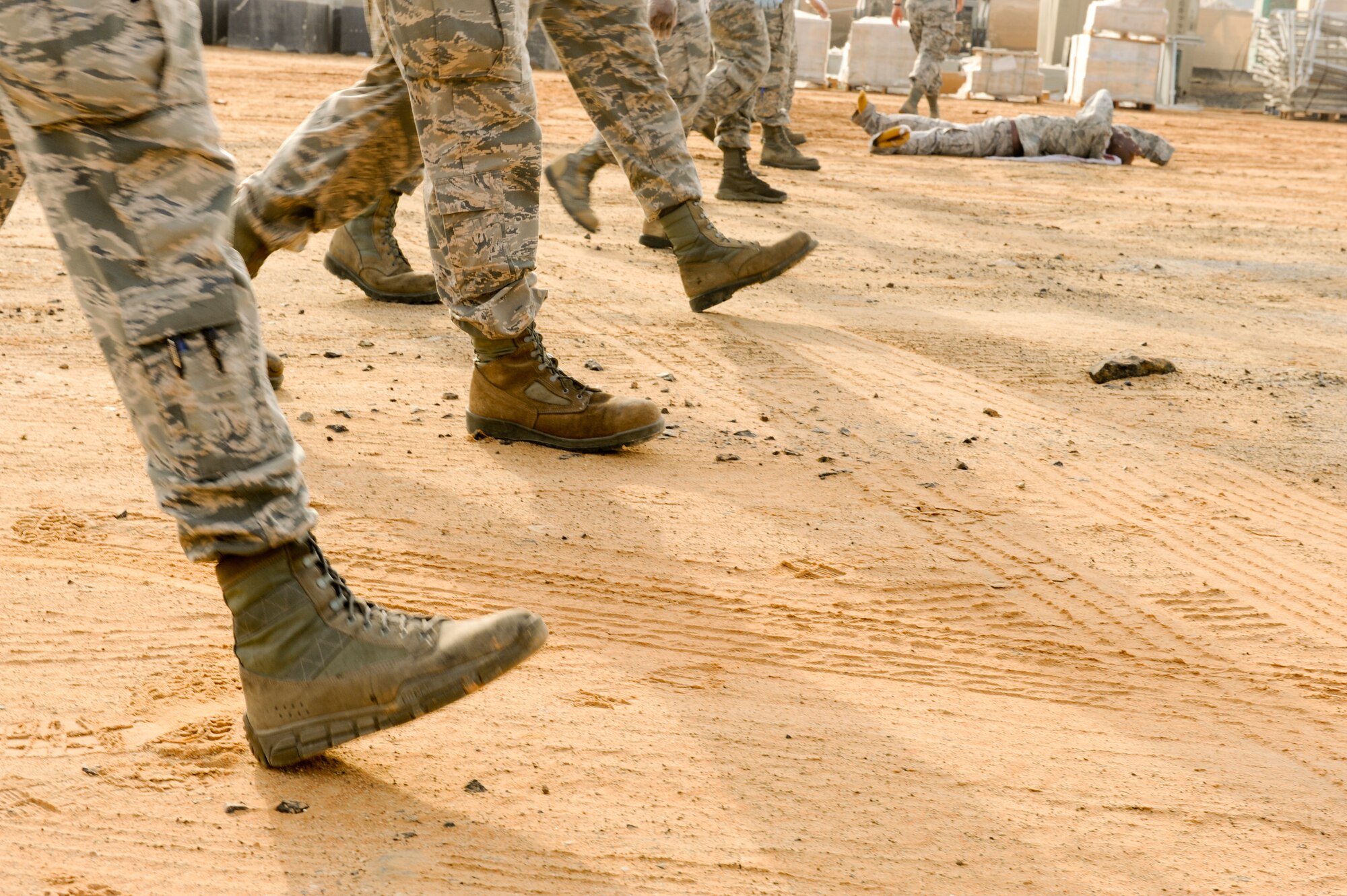 Airman from the 380th Expeditionary Force Support Squadron search and recovery team walks in straight line during search and recovery training at an undisclosed location in Southwest Asia July 23, 2013. The search line is kept as straight as possible to ensure that no item will be overlooked.  (U.S. Air Force photo by Staff Sgt. Joshua J. Garcia) 