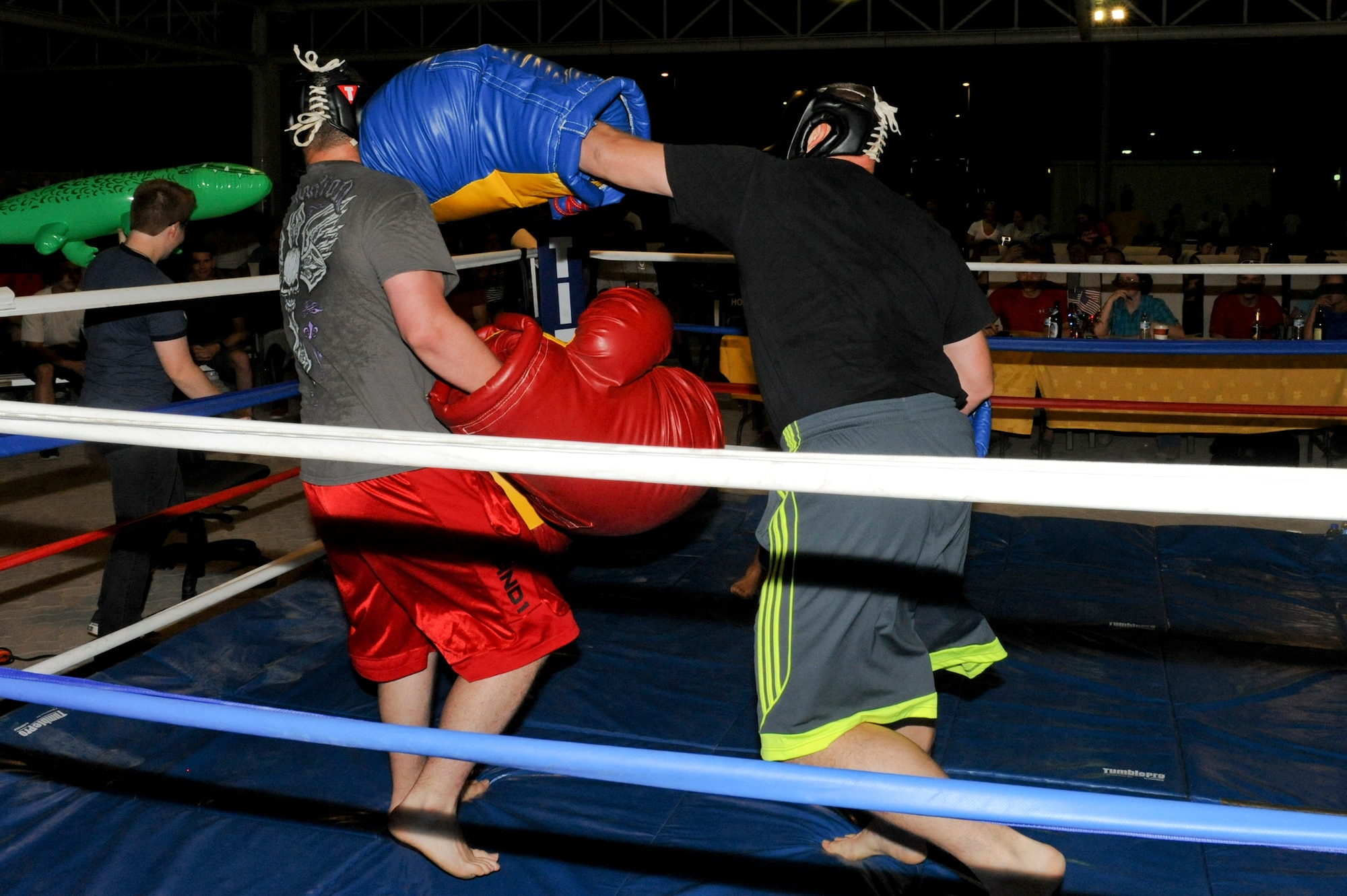 U.S. Army Private Chance Parker, 1-62 Air Defense Artillery Battalion, is hit by an unblocked left by U.S. Army Staff Sgt. John Winger, 1-62 ADA, during a big glove boxing match at an undisclosed location in Southwest Asia Jul 19, 2013. Winger went on to win by way of knock-out. Both Parker and Winger are deployed from Ft. Hood, Texas. (U.S. Air Force photo by Staff Sgt. Joshua J. Garcia)