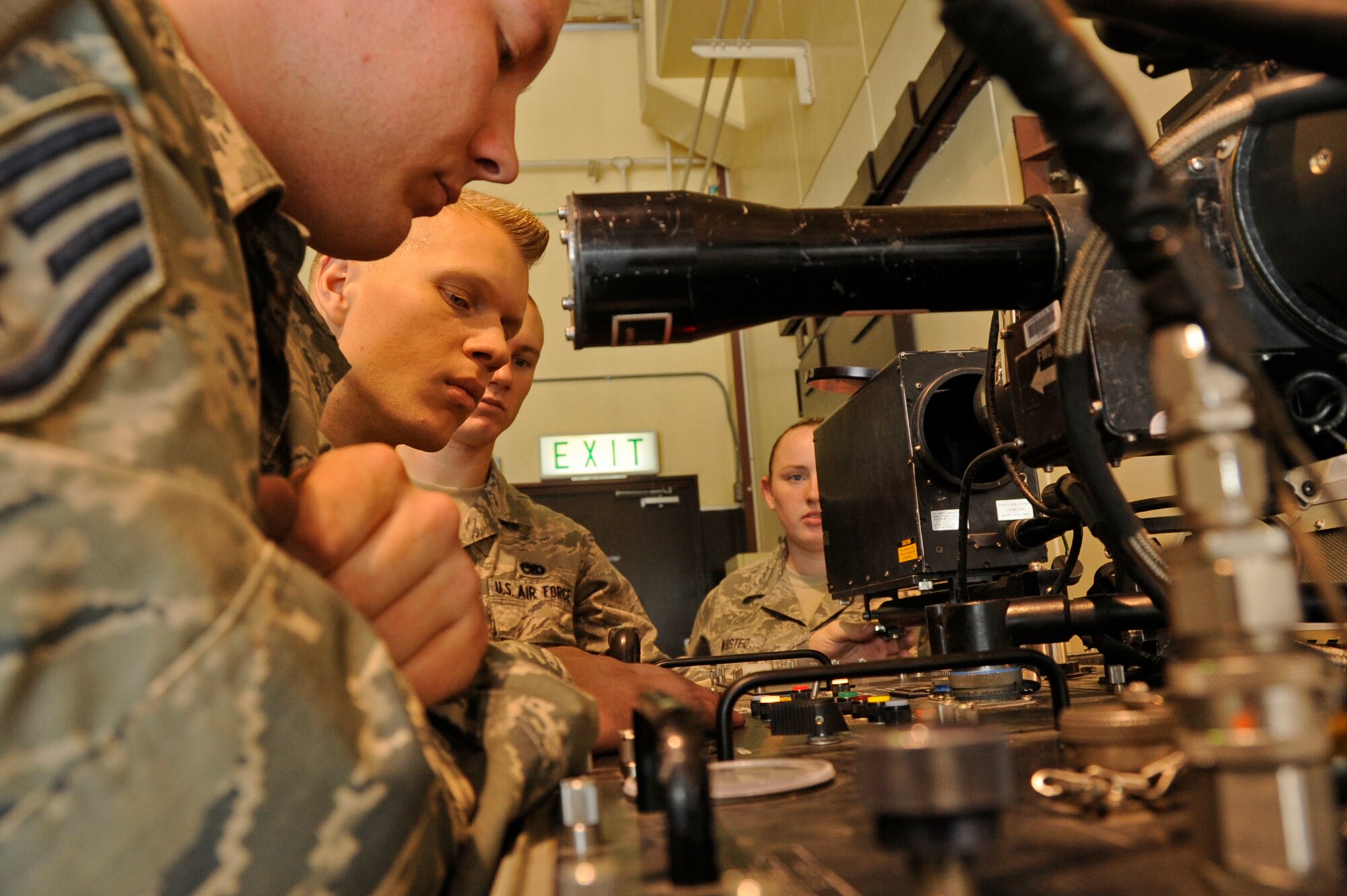 U.S. Air Force precision guided munitions Airmen with the 35th Maintenance Squadron, make sure all systems are ready prior to using a guidance control section unit test set to inspect an AIM-9 Sidewinder missile at Misawa Air Base, Japan, July 26, 2013.The AIM-9 Sidewinder is a supersonic, heat-seeking, air-to-air missile carried by a fighter aircraft. It has a high-explosive warhead and an active infrared guidance system. (U.S. Air Force photo by Airman 1st Class Kenna Jackson)