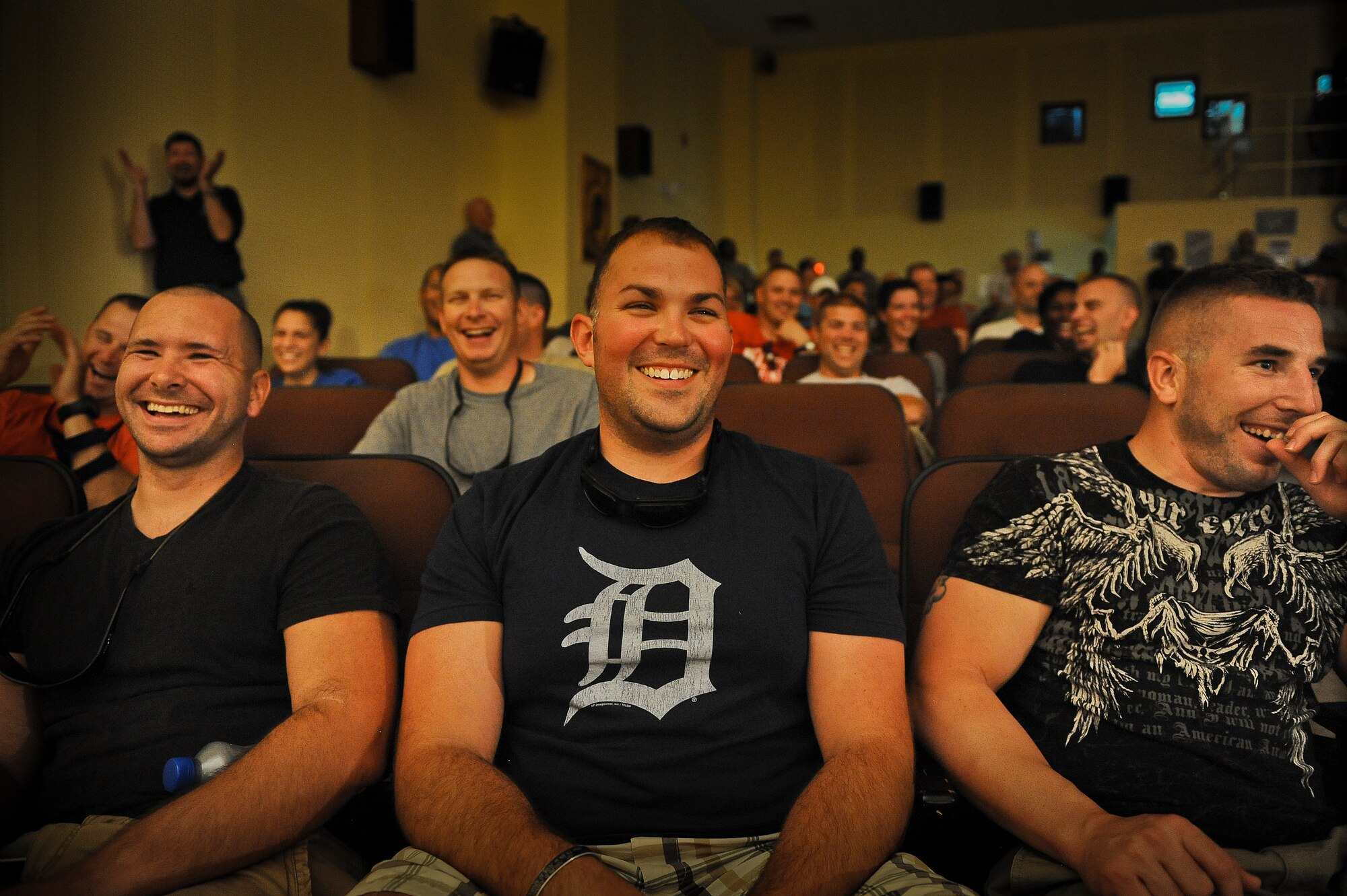 A joke by the Comedian “Spanky” gets a big laugh from the Airmen deployed to an undisclosed location in Southwest Asia Saturday, July 20, 2013.  (U.S. Air Force Photo by 1st Lt. Nathan Wallin)