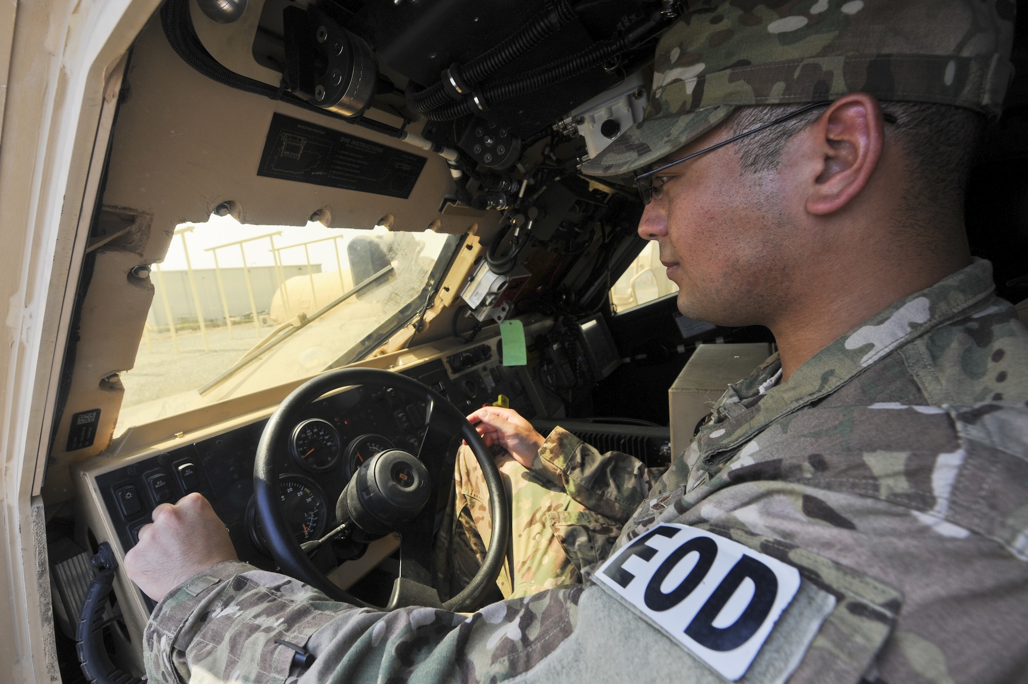 U.S. Air Force Senior Airman Jeremy Moody, 380th Expeditionary Civil Engineer Squadron explosive ordnance disposal technician, starts a mine-resistant ambush-protected vehicle at an undisclosed location in Southwest Asia July 25, 2013. The 380th Air Expeditionary Wing EOD team is responsible for disabling conventional munitions and IEDs. Moody calls Baton Rouge, La., home and is deployed from Davis-Monthan Air Force Base, Ariz. (U.S. Air Force photo by Senior Airman Jacob Morgan)