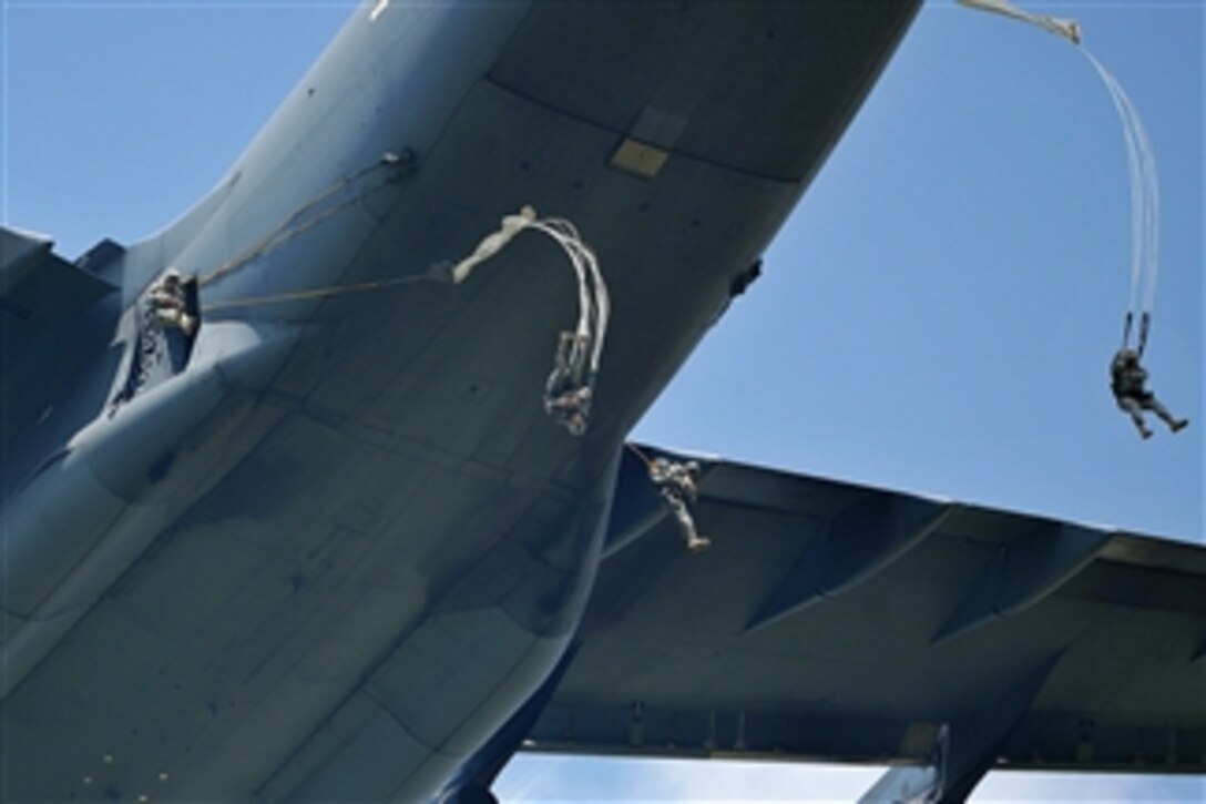 U.S. Army paratroopers from the 173 Airborne Brigade Combat Team jump from a U.S. Air Force C-17 Globemaster III over the Juliet Drop Zone in Pordenone, Italy, on June 12, 2013.  