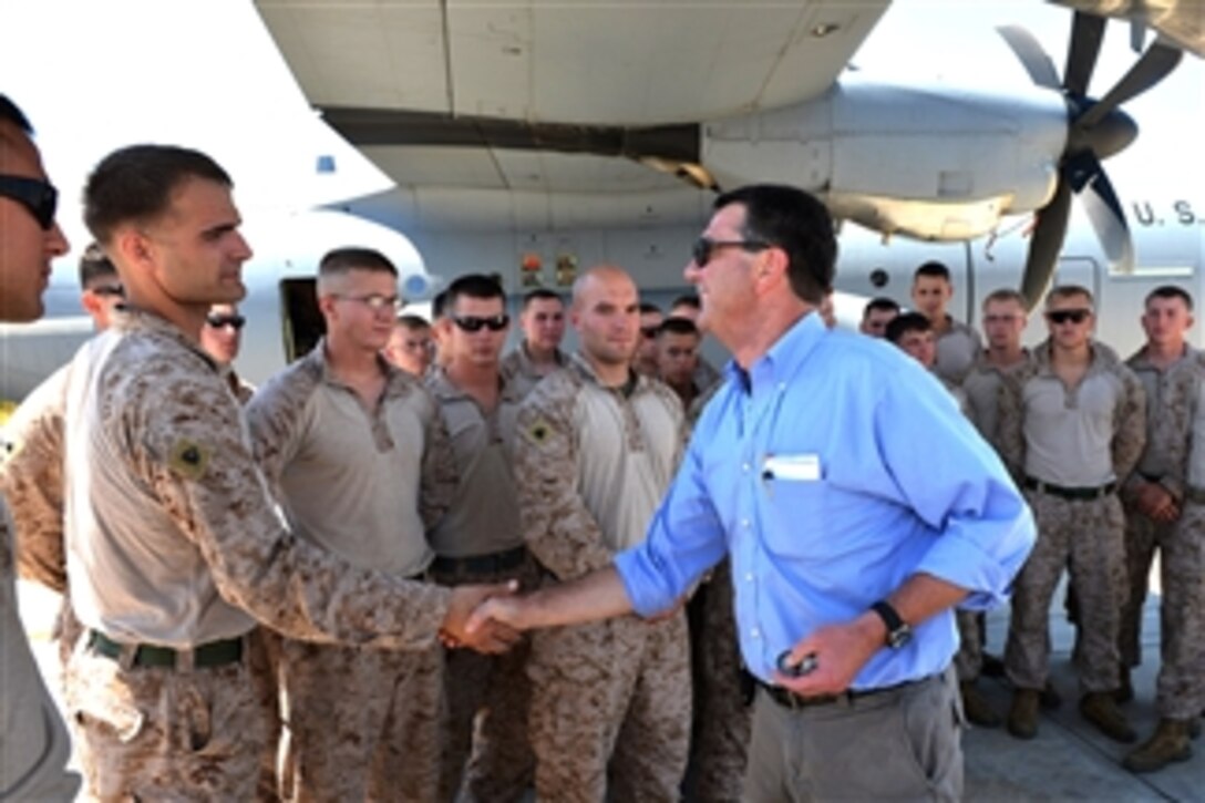 Deputy Secretary of Defense Ashton B. Carter talks with U.S. Marines during a refueling stop at Souda Bay, Greece, on July 25, 2013.  Carter thanked each Marine individually for their service.  Carter is returning from a weeklong trip to Israel, Uganda and Ethiopia, where he met with senior government and military leaders of those nations.  