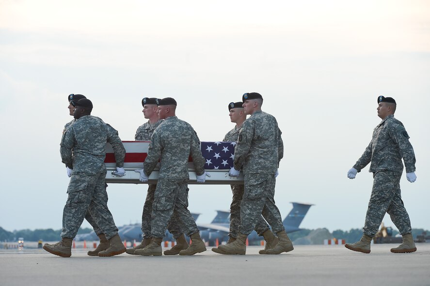 A U.S. Army carry team transfers the remains of Sgt. Anthony R. Maddox, of Port Arthur, Texas, during a dignified transfer July 27, 2013 at Dover Air Force Base, Del. Maddox was assigned to the 10th Brigade Support Battalion, 1st Brigade Combat Team, 10th Mountain Division, Fort Drum, N.Y. (U.S. Air Force photo/Greg Davis)