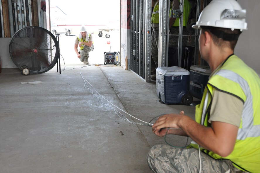 The 583rd RED HORSE completed their first deployed mission as a squadron during an Innovative Readiness Training project near Clarksdale, Miss., July 7-21. The RED HORSE squadron (Rapid Engineer Deployable Heavy Operational Repair Squadron Engineers) completed multiple structural, electrical and utilities tasks for the Fletcher Field Airport during the two-week deployment.  (U.S. Air Force Photo by Capt Joe Simms)

