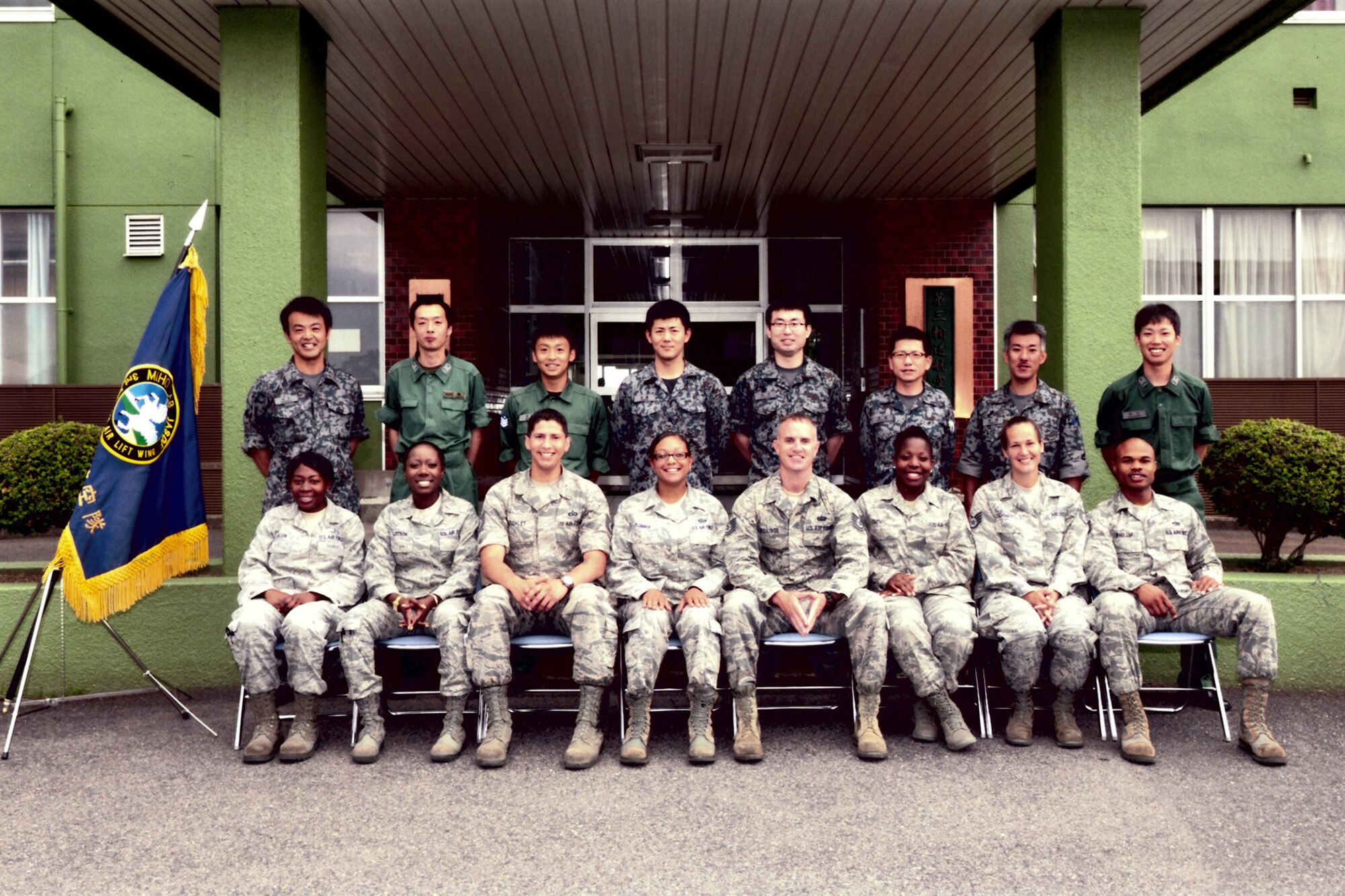 MIHO AIR BASE, Japan -- U.S. Airmen from Yokota Air Base, Japan, and Japan Air Self-Defense Force Airmen from Miho Air Base, Japan, take a photo at the conclusion of the non-commissioned officer exchange. A total of 16 Airmen from the allied services took part in teh annual exchange between the U.S. and JASDF. (Courtesy photo)