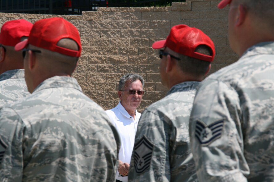 Retired Chief Master Sgt. Wayne Isett, chairman, Grantville Volunteer Fire Company, addresses the audience at the dedication ceremony as Airman of the 193rd Special Operations Wing’s 201st RED HORSE Squadron, Annville, Pa., listen. The RHS contributed to the building of the new fire station by providing survey and excavation services.  The Airmen of the RHS were able to save the Fire Company approximately $400,000, while gaining valuable training and being able to give back to the community. (U.S. Air National Guard photo by Senior Airman Claire Behney/Released)