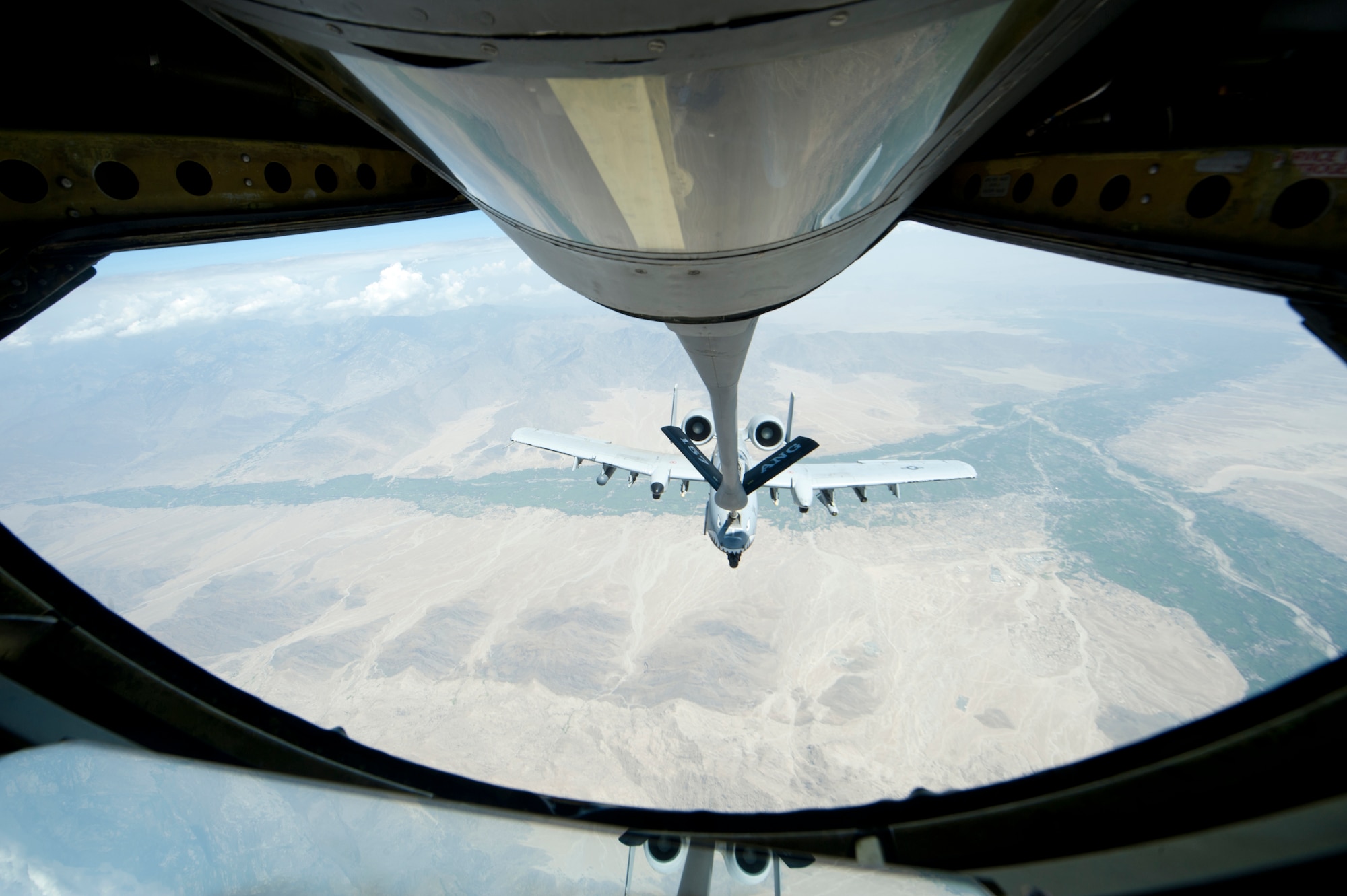 Maj. Matt Paetzhold flies an A-10 Thunderbolt II while it is refueled by a KC-135 Stratotanker from Transit Center at Manas, Kyrgyzstan, over Afghanistian July 25, 2013. The A-10 has maneuverability at low air speeds and altitude, and is an accurate and survivable weapons-delivery platorm. (U.S. Air Force photo/Staff Sgt. Robert Barnett)