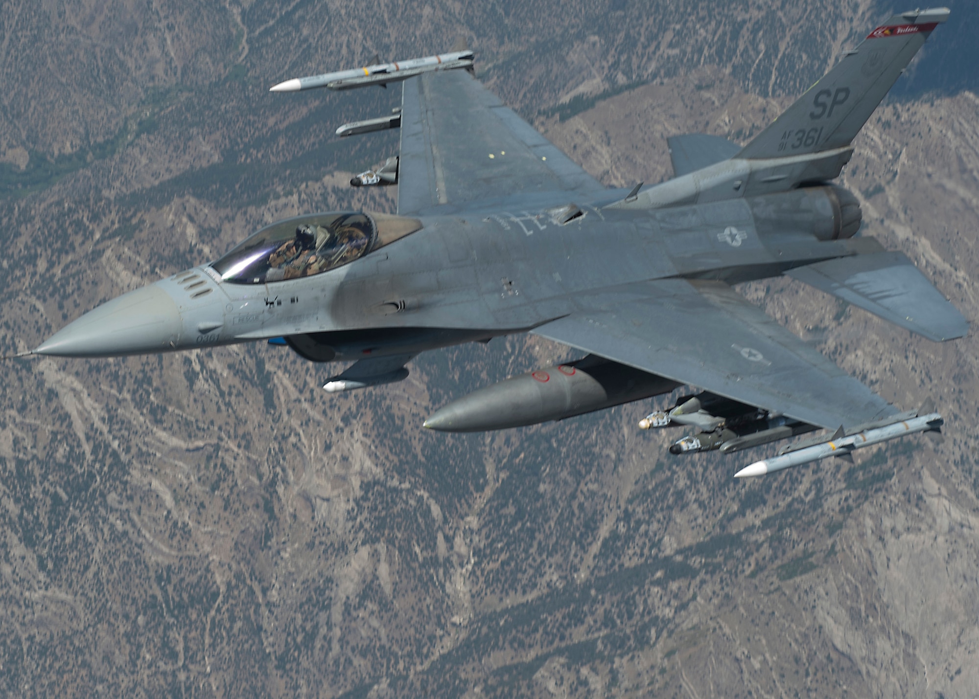 An F-16 Fighting Falcon flies over Afghanistan after being refueled July 25, 2013. The F-16 is a compact, multi-role fighter aircraft that is highly maneuverable and has proven itself in air-to-air combat and air-to-surface attack. It provides a relatively low-cost, high-performance weapon system for the U.S. and allied nations. (U.S. Air Force photo/Staff Sgt. Robert Barnett)