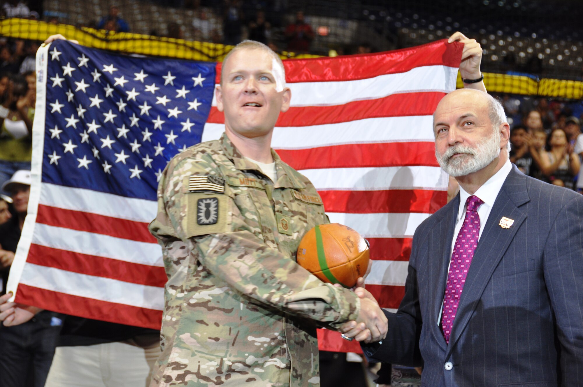 Master Sgt. Robert Mott, 433rd Explosive Ordnance Disposal Flight Program Manager, was honored during a ceremony in the third quarter of the San Antonio Talons versus Philadelphia Soul game on July 27.  The crowd of 9,112 witnessed AFL Commissioner Jerry Kurz, along with the Talons, honor Mott during the third quarter in recognition of his receiving the Bronze Star for his actions in Fallujah, Iraq.  (Photo by Tech Sgt. Carlos J. Trevino)