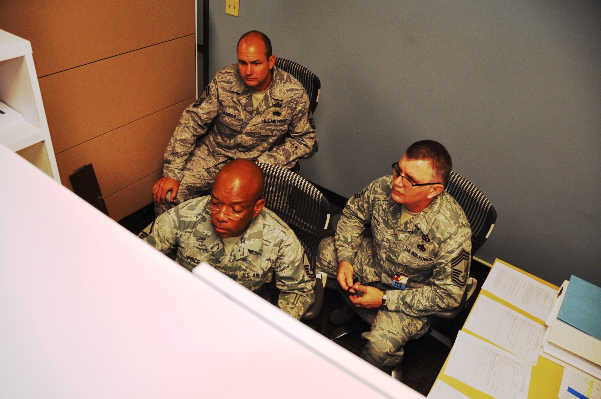 Senior Master Sgt. Craig Arnold (top) and Master Sgt. Bryan Price (bottom) 433rd Wing Safety Office, listen to input from Chief Master Sgt. Randey Hayes, Air Force Reserve Command Inspector General, during a Compliance Inspection July 27 and Joint Base San Antonio-Lackland. The IG spent a week at the 433rd to inspect the wing’s readiness. (Air Force photo by Tech Sgt. Carlos J. Trevino)