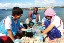 Cpl. Andy Cazeau, center, picks up litter with community members July 15 during the Aqua Social Fes 2013 “Vitamin Sea” where community members and service members cleaned the shoreline of Inanse in Urasoe. Cazeau is an electrician with Facilities Engineers Division, Marine Corps Base Camp Smedley D. Butler, Marine Corps Installations Pacific.


