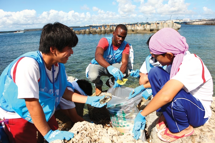 Cpl. Andy Cazeau, center, picks up litter with community members July 15 during the Aqua Social Fes 2013 “Vitamin Sea” where community members and service members cleaned the shoreline of Inanse in Urasoe. Cazeau is an electrician with Facilities Engineers Division, Marine Corps Base Camp Smedley D. Butler, Marine Corps Installations Pacific.


