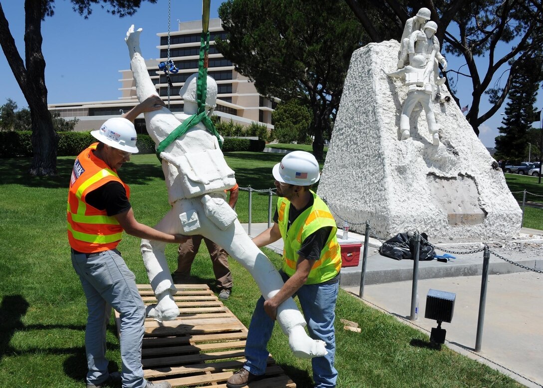 Employees of Clark Construction Group and McCarthy Building Companies Inc. place a hospital corpsman from the Naval Hospital Camp Pendleton Hospital Corpsman Combat Memorial on a pallet for transportation to storage.  The statues on the monument are being individually removed and will be reassembled on a new base at the replacement hospital.  The new monument is scheduled to be completed later this year.  The memorial was created by Raul Avina, a World War II veteran who was in the battle of Iwo Jima, and was dedicated in 1983 for the services and sacrifices made by hospital corpsman in carrying out their duties during wartime.  

U.S. Navy photo by Mass Communication Specialist 1st Class Michael R. McCormick