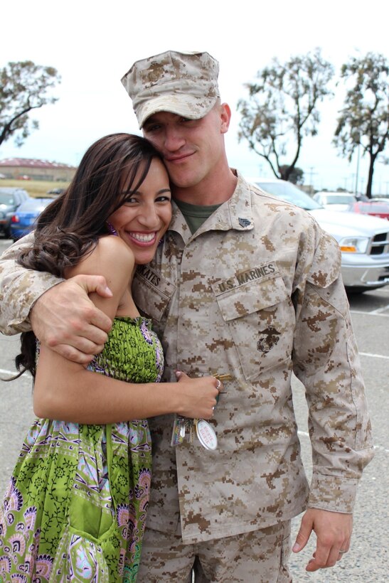 Sergeant Richard Skates, a 25-year-old native of O'Fallon, Mo., and an amphibious assault vehicle crewman serving with Charlie Company, 3rd Assault Amphibian Battalion, standing with his wife, Jacqueline Skates, a 22-year-old native of O'Fallon, Mo., helped save the lives of four when he rushed to their rescue after their vehicle crashed on Interstate Highway 5, July 9, 2013. The Skates, along with their 2-month-old son, were traveling on an exit ramp from state Route 78 to Interstate Highway 5 when he selflessly rushed to save a family from an overturned car that was involved in a crash.