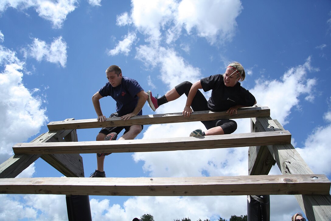 Poolees with RS St. Louis maneuver an obstacle during a monthly pool function July 27 in Greenville, Ill. For additional imagery visit https://www.facebook.com/stlouismarines?ref=tn_tnmn#!/stlouismarines. (U.S. Marine Corps photo by Cpl. Erik S. Brooks Jr. 