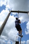 A Poolee with RS St. Louis maneuvers up a rope during a monthly pool function July 27 in Greenville, Ill. For additional imagery visit https://www.facebook.com/stlouismarines?ref=tn_tnmn#!/stlouismarines. (U.S. Marine Corps photo by Cpl. Erik S. Brooks Jr. 
