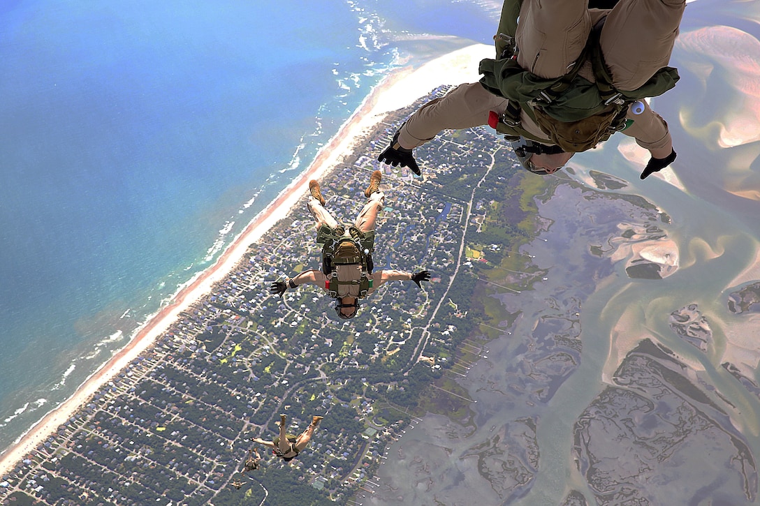 Marines with U.S. Marine Corps Forces, Special Operations Command freefall during a High Altitude Low Opening (HALO) training exercise at an airfield in North Carolina, July 8, 2013.  The Marines conducted the HALO jump to reinforce the skills employed to safely complete the exercise. (U.S. Marine Corps photo by Lance Cpl. Steven Fox/Released)