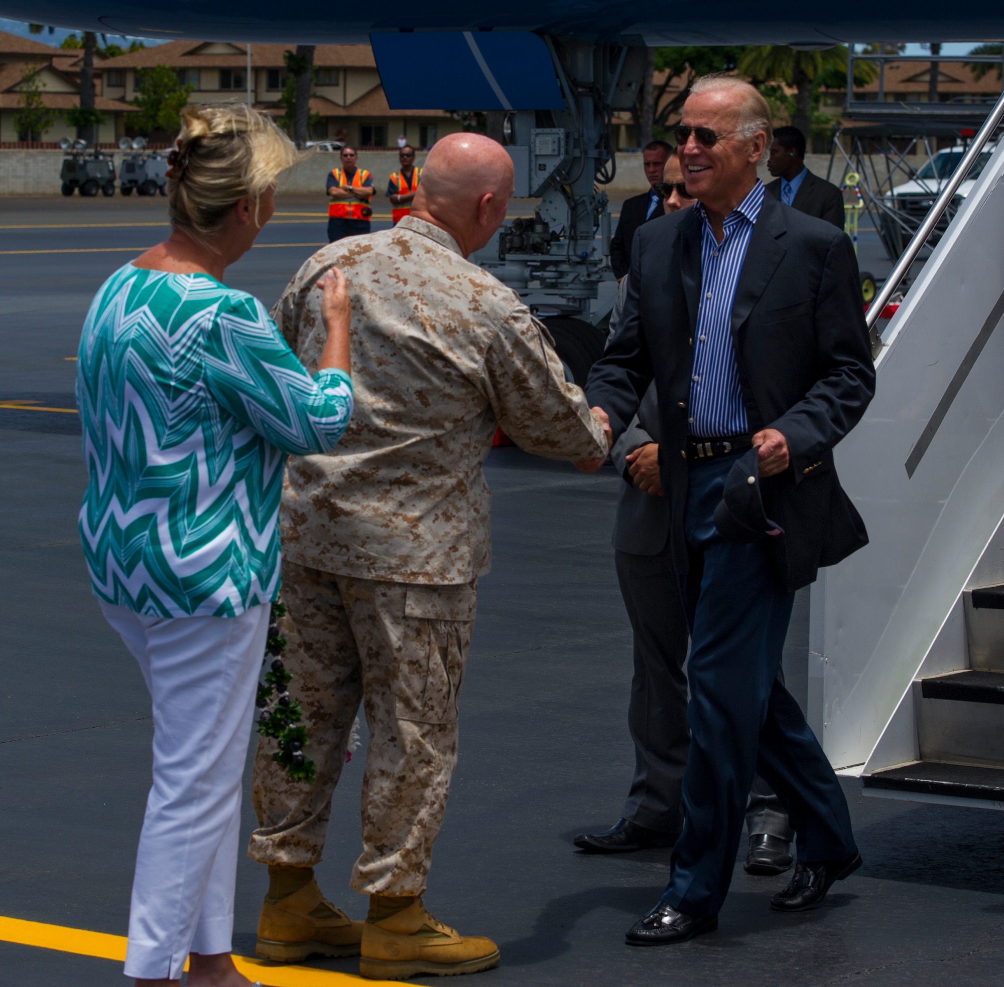 Vice President Joe Biden and his wife, Jill, are greeted by Lt. Gen. Thomas Conant, Pacific Command deputy commander, and his wife, Beverly, after the vice president landed at Joint Base Pearl Harbor-Hickam, Hawaii, July 27, 2013. Biden's stop in Hawaii followed an overseas trip to India and Singapore. (U.S. Air Force photo by Staff Sgt. Nathan Allen)