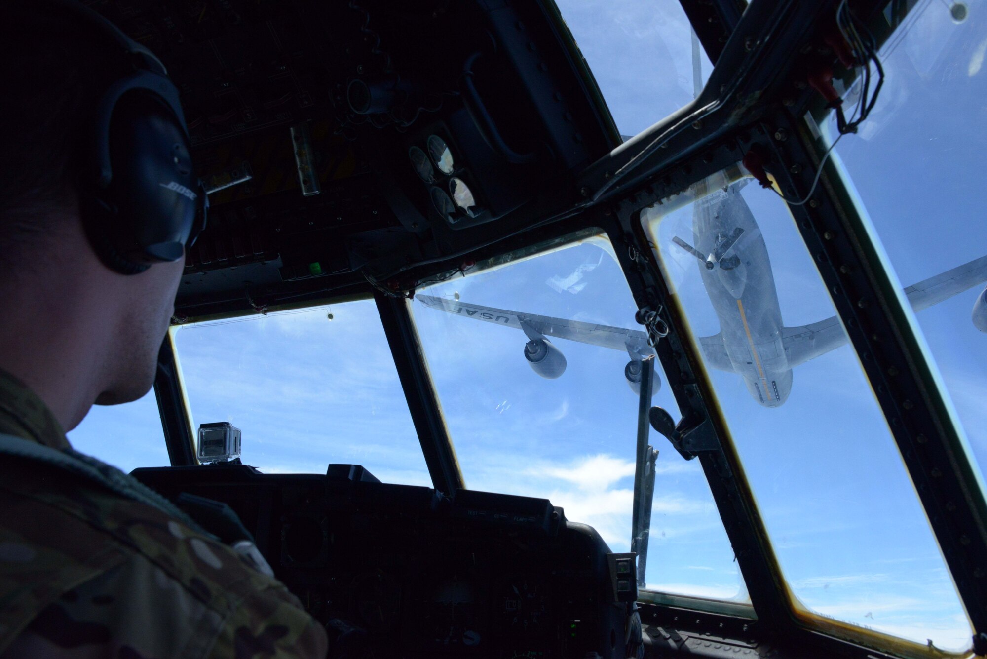 A KC-135 Stratotanker from the 909th Air Refueling Squadron departs after refueling an MC-130P Combat Shadow from the 17th Special Operations Squadron during an air-to-air refueling mission over the East China Sea July 19, 2013.  The squadrons regularly conduct air-to-air refueling missions in order to ensure training proficiency for aircrews in both units.. (U.S. Air Force photo by Tech. Sgt. Kristine Dreyer)