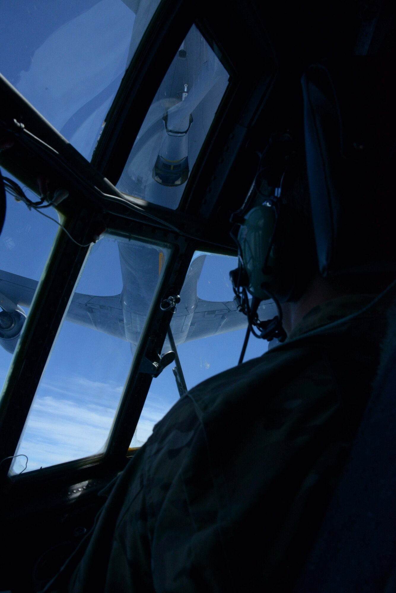 A KC-135 Stratotanker from the 909th Air Refueling Squadron refuels an MC-130P Combat Shadow from the 17th Special Operations Squadron during an air-to-air refueling mission over the East China Sea July 19, 2013.  The squadrons regularly conduct air-to-air refueling missions in order to ensure training proficiency for aircrews in both units. (U.S. Photo by Tech. Sgt. Kristine Dreyer)