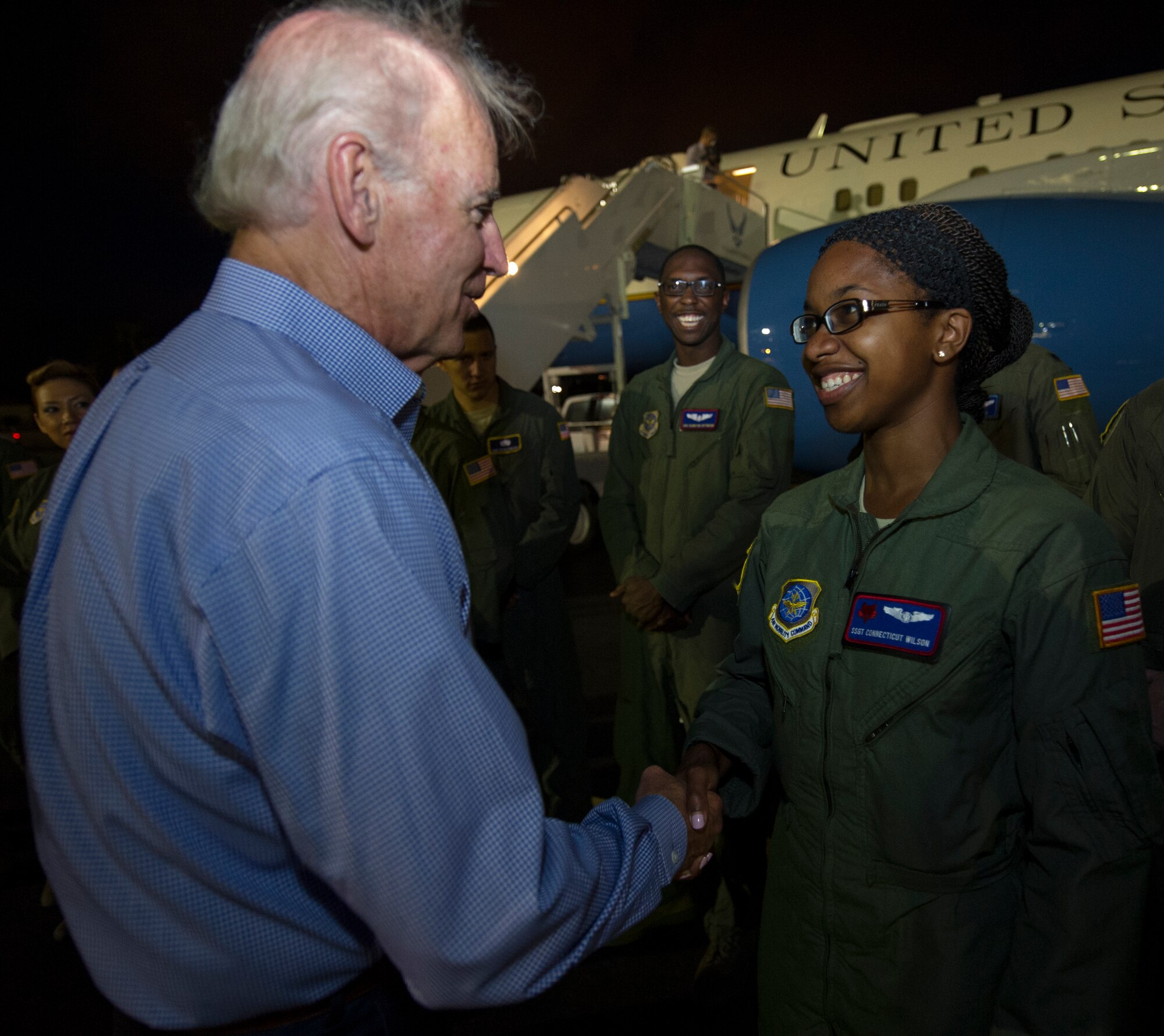 Vice President Joe Biden bids "Aloha" to Staff Sgt. Connecticut Wilson, a special air missions flight attendant from the 1st Airlift Squadron at Andrews Air Force Base, Md. before departing Joint Base Pearl Harbor-Hickam, Hawaii, upon Air Force Two, July 28, 2013. During his stop in Hawaii, Biden and his wife took time to visit with more than 500 service members and their families at JBPHH. (U.S. Air Force photo by Staff Sgt. Nathan Allen)