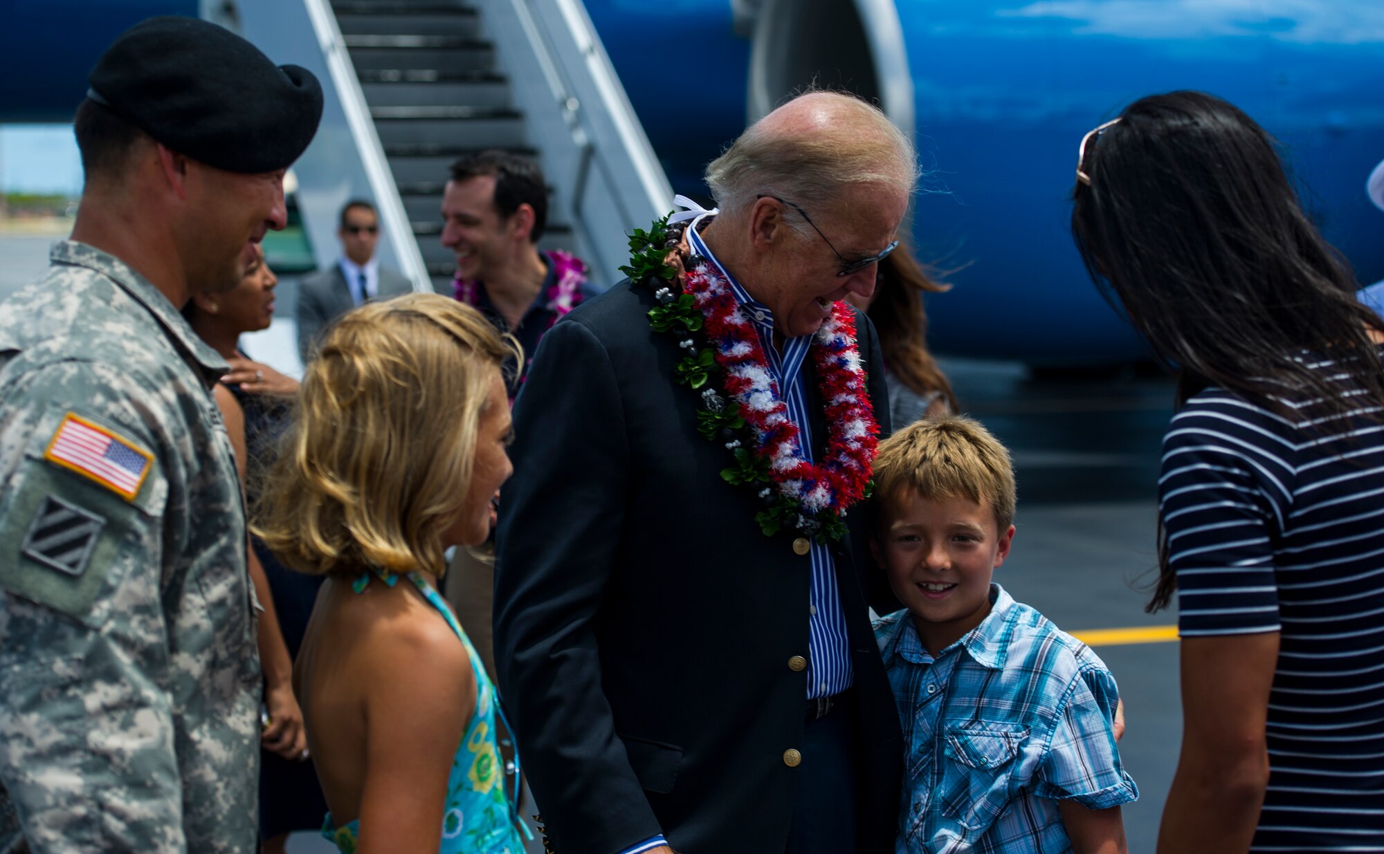 Vice President Joe Biden reunites with the family of U.S. Army Lt. Col. Ike Sallee, commander of the 114th Infantry Battalion at Schofield Barracks, Hawaii, after Biden arrived at Joint Base Pearl Harbor-Hickam, Hawaii, July 27, 2013. Sallee is a former military executive aide to Vice President Biden. (U.S. Air Force photo by Staff Sgt. Nathan Allen)