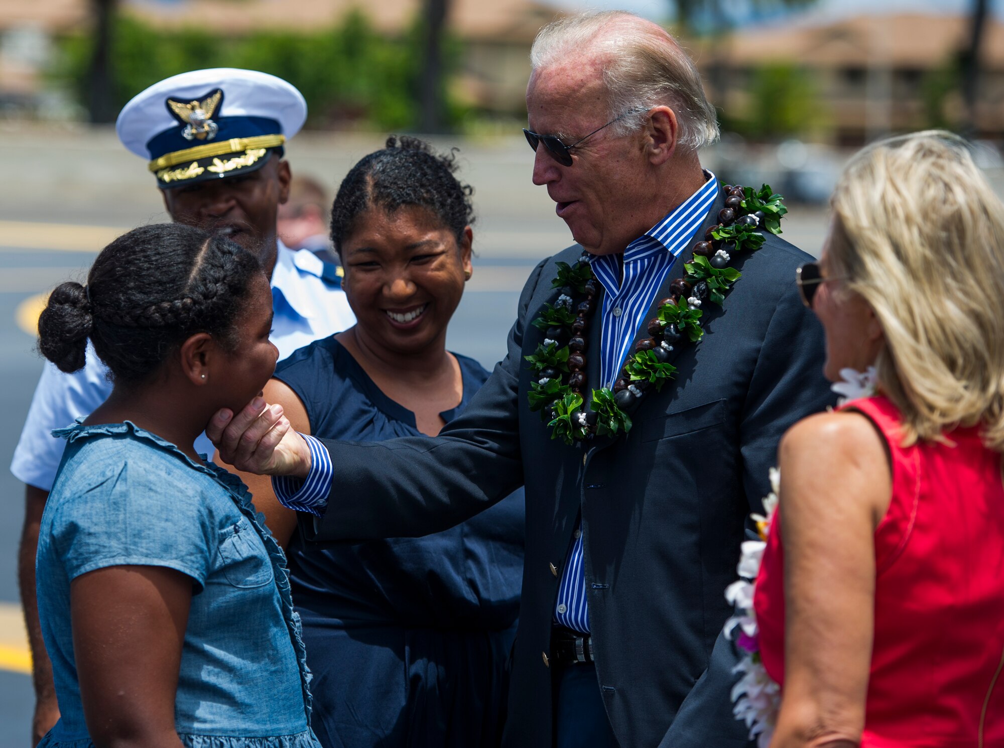 Vice President Joe Biden and his wife, Jill, reunite with Kara Neal, daughter of U.S. Coast Guard Cmdr. Prince Neal, after Biden arrived at Joint Base Pearl Harbor-Hickam, Hawaii, July 27, 2013. Neal is a former military executive aide to Vice President Biden. (U.S. Air Force photo by Staff Sgt. Nathan Allen)