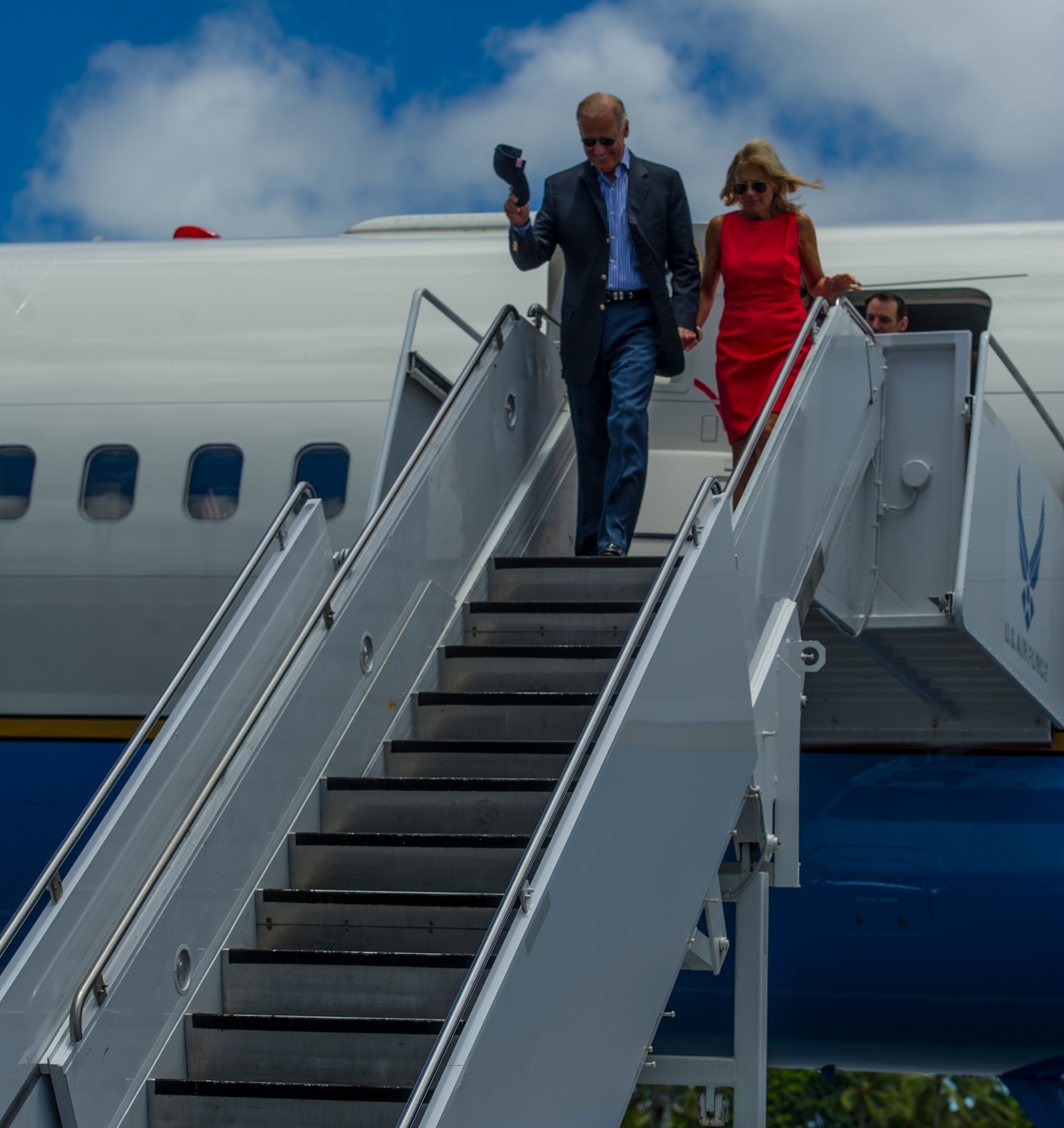 Vice President Joe Biden and his wife, Jill, deplane Air Force Two after arriving at Joint Base Pearl Harbor-Hickam, Hawaii, July 27, 2013. During his stop in Hawaii, Biden and his wife took time to visit with more than 500 service members and their families at JBPHH. (U.S. Air Force photo by Staff Sgt. Nathan Allen)