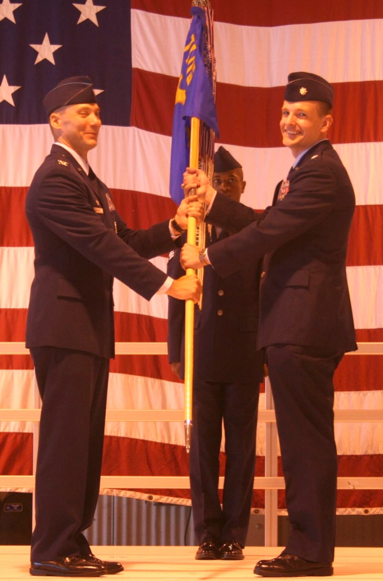 Lt. Col. Sean Martin, right, accepts the 3rd Flying Training Squadron guidon from Col. James Abatti, 71st Operations Group commander, during a change of command ceremony held June 13 at Vance Air Force Base, Okla. (Courtesy photo)
