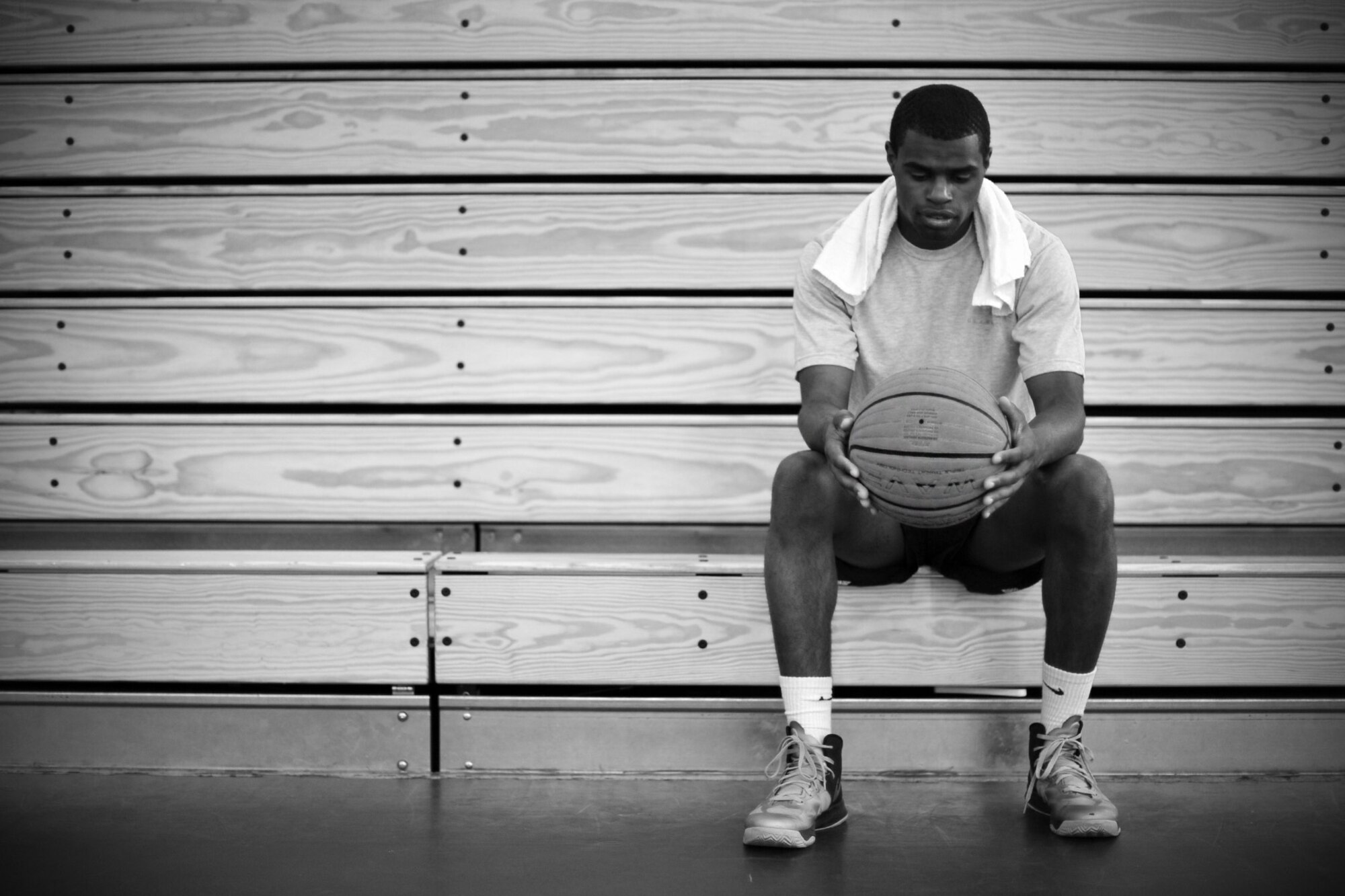 Airman 1st Class Cedric King II, 92nd Force Support Squadron career development apprentice, relaxes after a practice session of basketball at the fitness center at Fairchild Air Force Base, Wash., July 25, 2013. King will be attending the training camp for the Air Force basketball team in October. (U.S. Air Force photo by Senior Airman Taylor Curry/Released) 