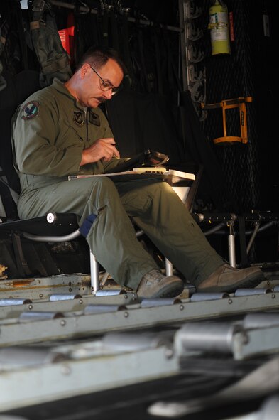 Chief Master Sgt. Jeff Rutter, chief enlisted manager from the 9th Special Operations Squadron, completes a preflight inspection for the last flight of the MC-130P, bearing tail number 5827, at Hurlburt Field, Fla., July 29, 2013. This Combat Shadow was the last MC-130P to leave Iraq during Operation Iraqi Freedom. (U.S. Air Force photo/Staff Sgt. Eboni Reams)