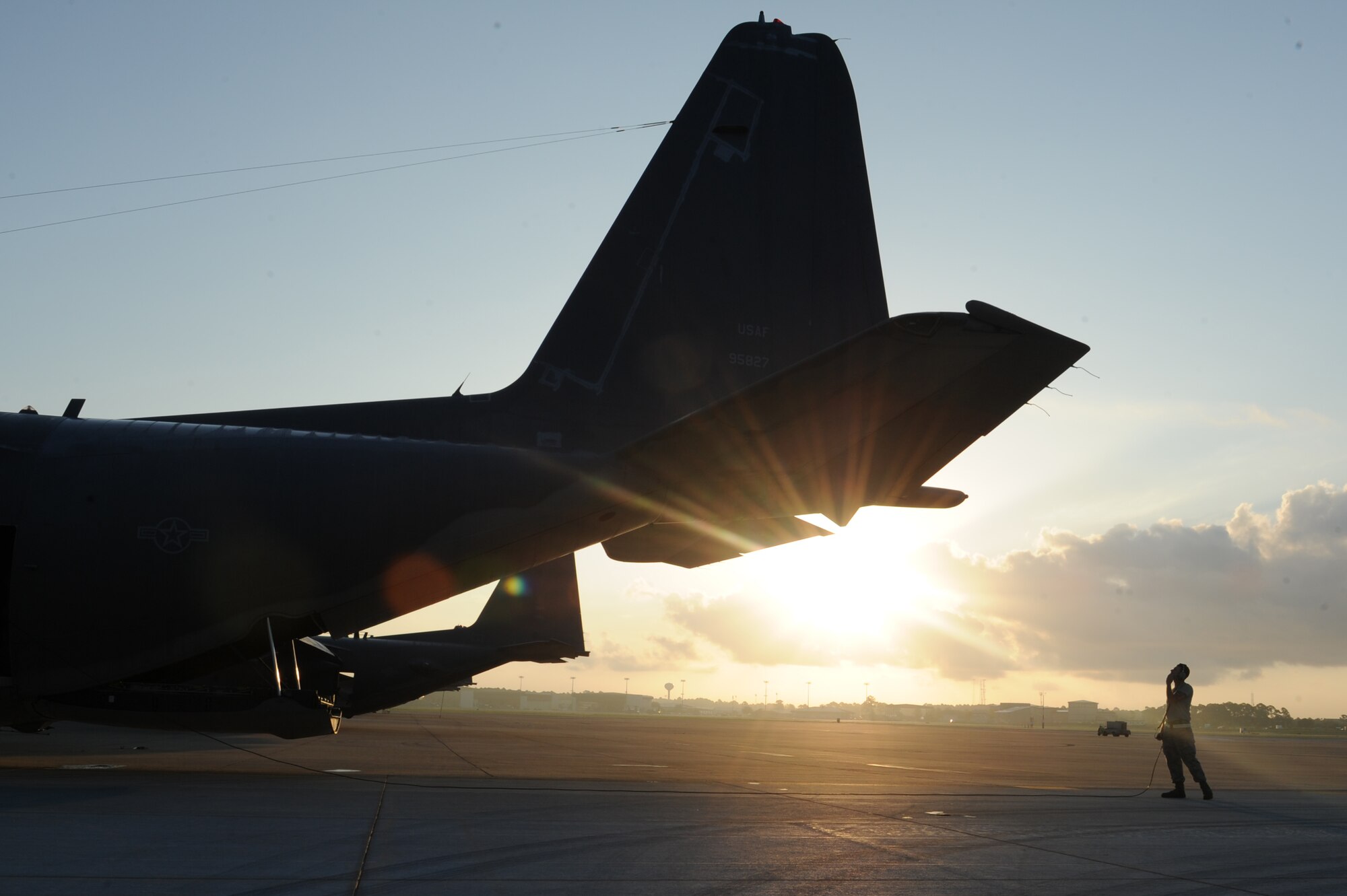 Senior Airman Nolan Kessler, 1st Special Operations Maintenance Squadron crew chief, completes a preflight inspection on a MC-130P Combat Shadow at Hurlburt Field, Fla., July 29, 2013. This aircraft, bearing tail number 5827, is being retired and sent to the boneyard at Davis-Monthan Air Force Base, Ariz.(U.S. Air Force photo/Staff Sgt Eboini Reams)