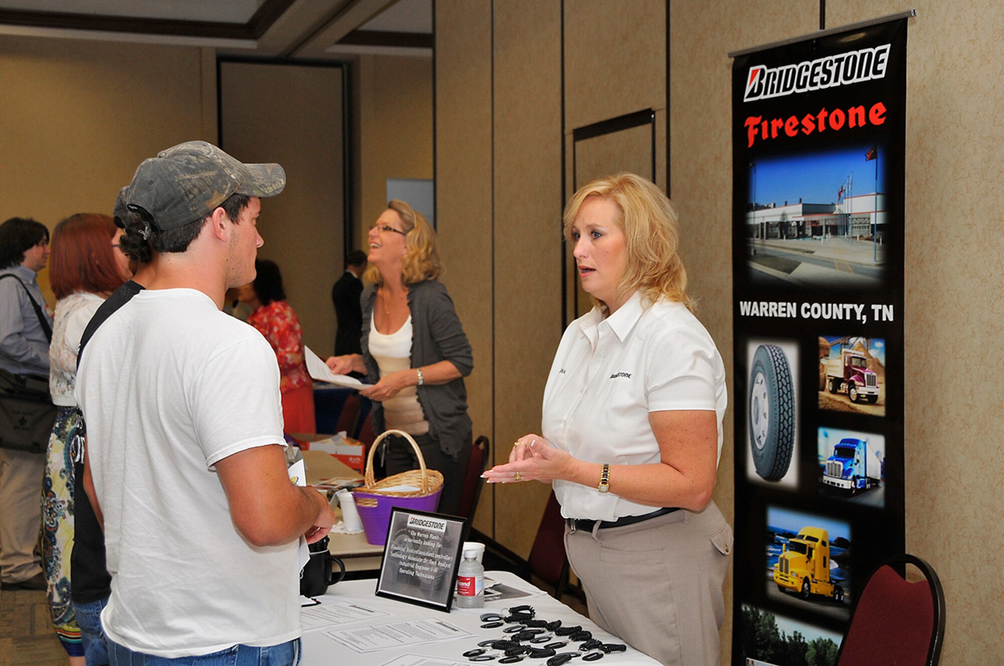 A representative from Bridgestone talks with a potential employee during the recent job fair sponsored by Arnold Community Council and Tennessee Senator Janice Bowling.

