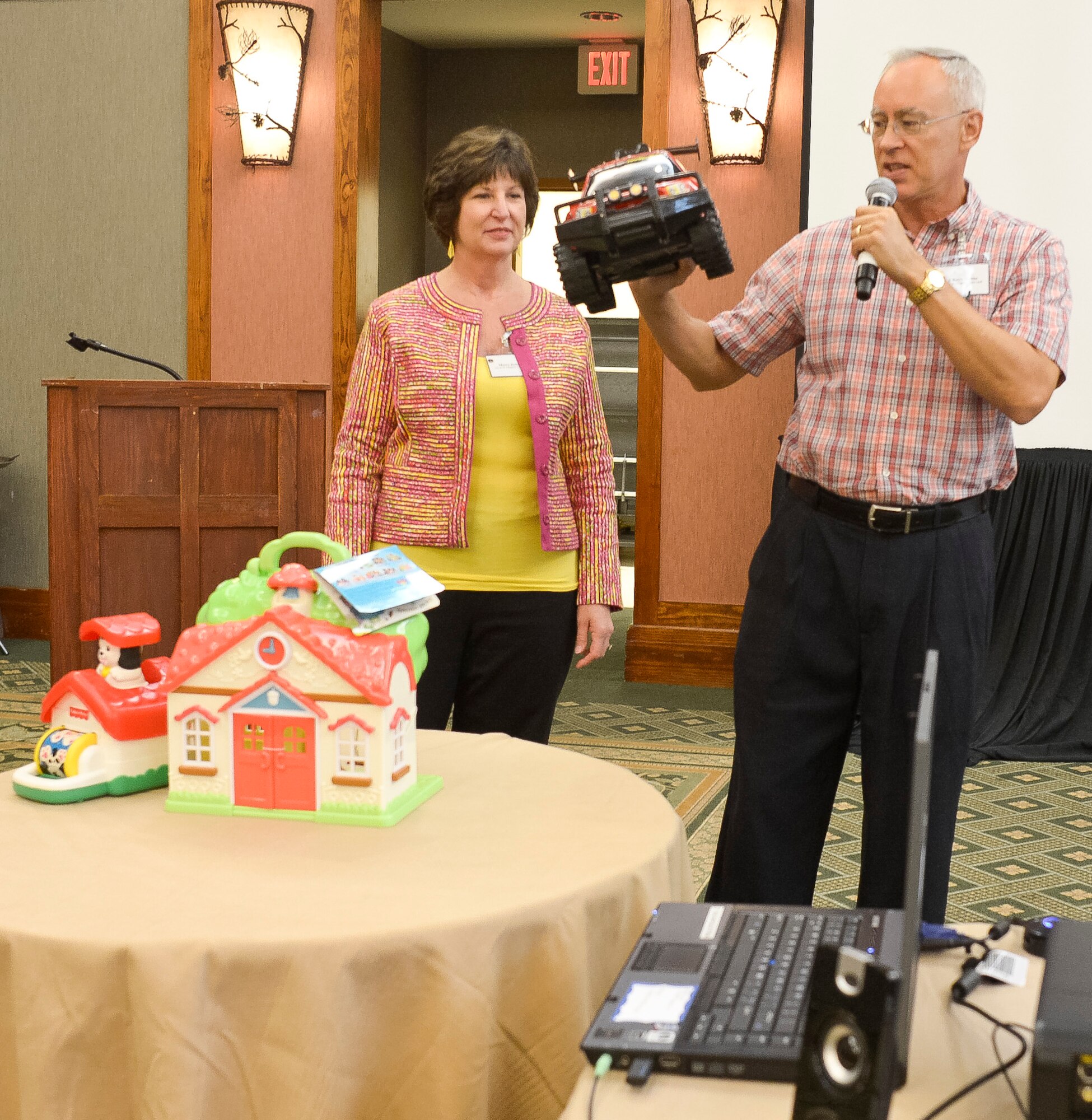 Chaplain (Lt. Col.) Keith Dobbe, senior chaplain for the 116th Air Control Wing (ACW), and his wife Merry use props to teach about expectations couples have going into a marriage during the Strong Bonds marriage conference at Callaway Gardens, Pine Mountain, Ga., July 27, 2013. The conference is a chaplain led program, developed by the National Guard Bureau, offering three days of intensive training in a retreat like setting designed to help Guardsmen build and maintain a strong family structure.  Twenty nine couples attended the event hosted by the 116th ACW. (U.S. Air National Guard photo by Master Sgt. Roger Parsons/Released)