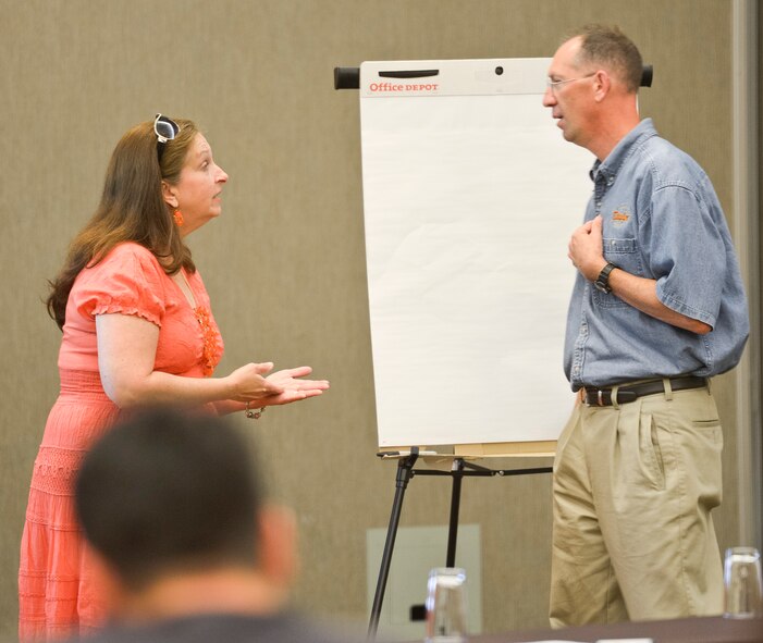 Chaplain (Maj.) James Taylor, with the 116th Air Control Wing (ACW), and his wife Nancy role play a marriage conflict scenario during the Strong Bonds marriage conference at Callaway Gardens, Pine Mountain, Ga., July 27, 2013. The conference is a chaplain led program, developed by the National Guard Bureau, offering three days of intensive training in a retreat like setting designed to help Guardsmen build and maintain a strong family structure.  Twenty nine couples attended the event hosted by the 116th ACW. (U.S. Air National Guard photo by Master Sgt. Roger Parsons/Released)