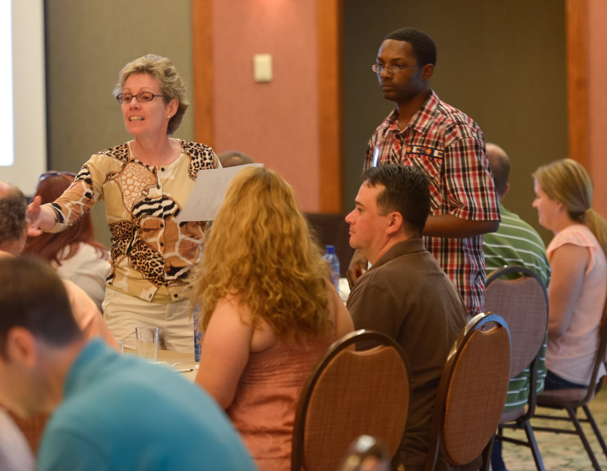 Chaplain (Lt. Col.) Elizabeth Harris-Lamkin, senior chaplain for the Georgia Air National Guard, and Staff Sgt. Steven Battle, chaplain assistant for the 116th Air Control Wing, assist couples from the 116th ACW and the 202nd Engineering Installation Squadron, Georgia Air National Guard, during the Strong Bonds marriage conference at Callaway Gardens, Pine Mountain, Ga., July 26, 2013. The conference is a chaplain led program, developed by the National Guard Bureau, offering three days of intensive training in a retreat like setting designed to help Guardsmen build and maintain a strong family structure.  Twenty nine couples attended the event hosted by the 116th ACW. (U.S. Air National Guard photo by Master Sgt. Roger Parsons/Released)