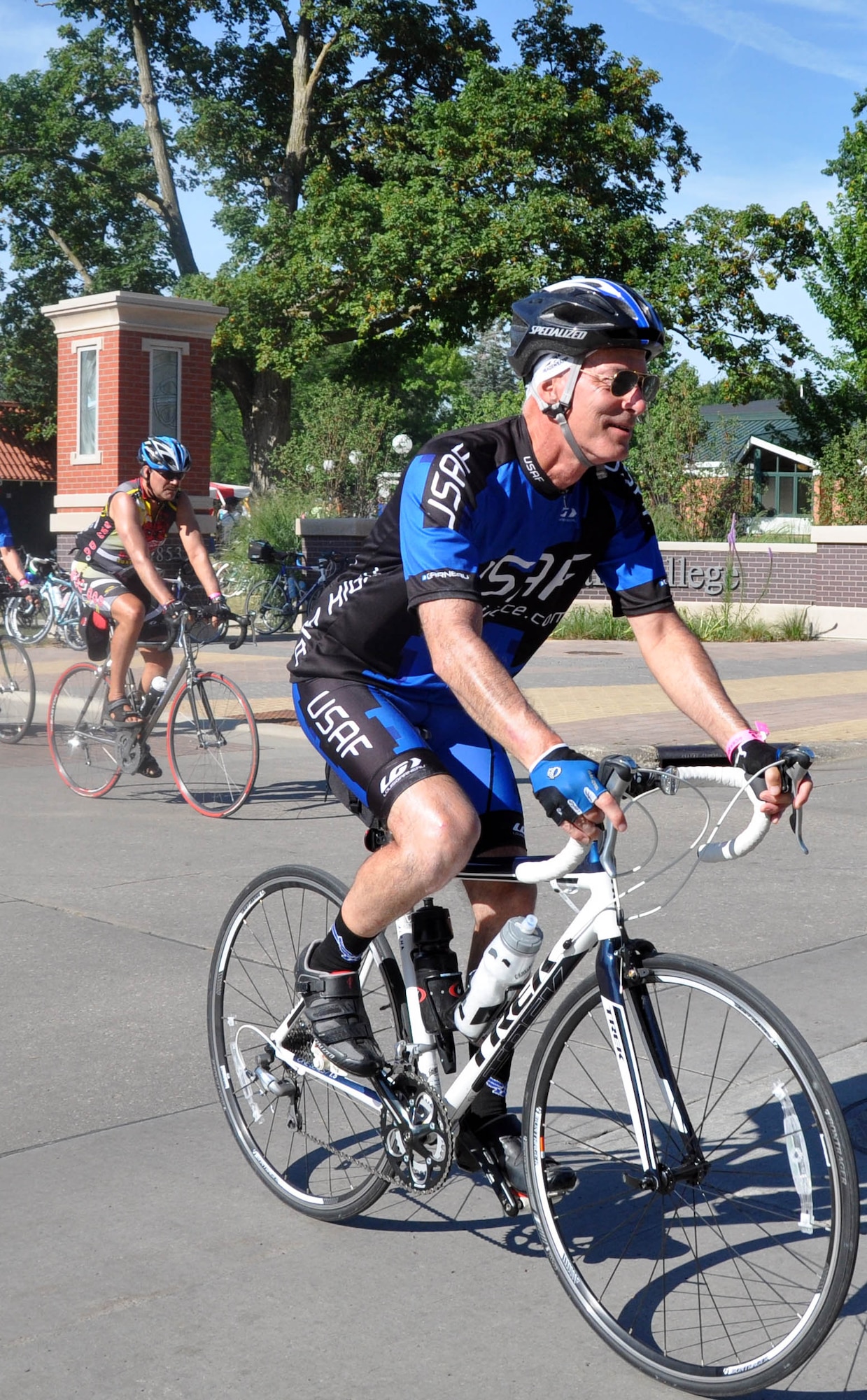 Tech. Sgt. Paul Shattuck, 931st Maintenance Squadron, rides through Pella, Iowa, as a member of the Air Force Cycling Team during the Register's Annual Great Bicycle Ride Across Iowa, July 25, 2013.  Despite a bicycle accident only a few weeks prior to RAGBRAI, Shattuck decided to follow through and ride in the seven-day event, which covers more than 400 miles across Iowa.  (U.S. Air Force photo by Staff Sgt. Abigail Klein)
