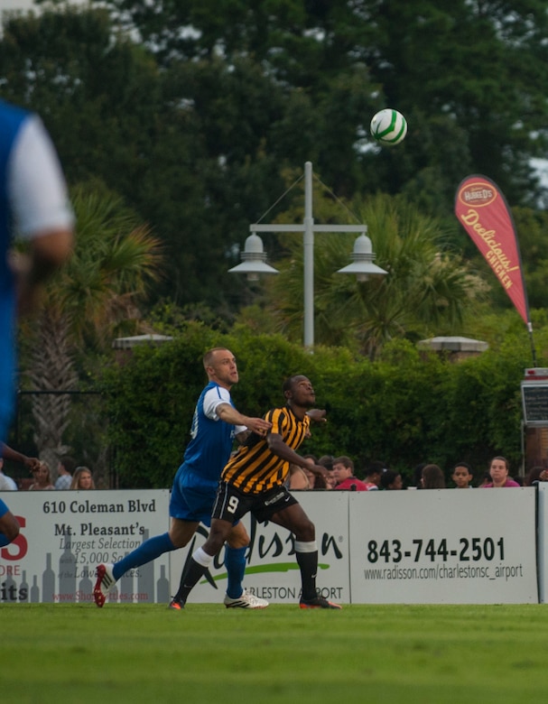 Dane Kelly of the Charleston Battery, goes up for a header July 27, 2013, during Military Appreciation Night at Blackbaud Stadium, Daniel Island, S.C. The Charleston Battery hosted Military Appreciation Night to show their support for the local military community. (U.S. Air Force photo/Senior Airman Ashlee Galloway)