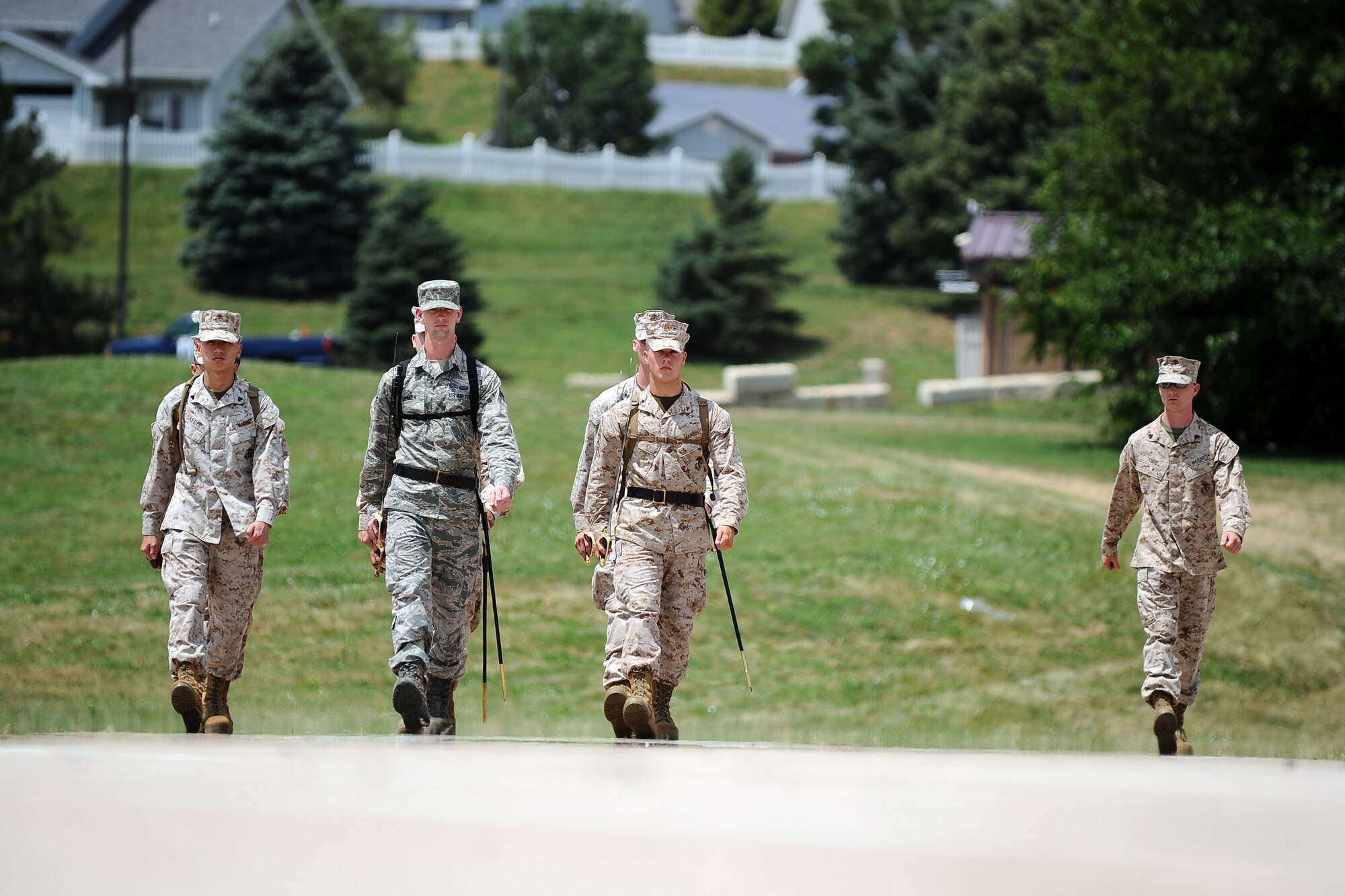 Attendees of the U.S. Marine Corps Corporals Leadership Course march in formation as they work on the Keeper of Tradition portion of training at Offutt Air Force Base, Neb., July 17. Marines from across the U.S. and several Airmen stationed at Offutt took part in the first U.S. Marine Corps Corporals Leadership Course hosted by the 55th Wing July 13-27.  (U.S. Air Force photo by Josh Plueger/Released)