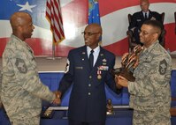 Chief Terry McCabe (center) is congratulated on his retirement by Chief Gordon Caviness (right) and Chief Kenny Smith (left). McCabe retired from military service and the 916th Air Refueling Wing during the July drill weekend. (USAF photo by SSgt. Mark Thompson, 916ARW/PA)